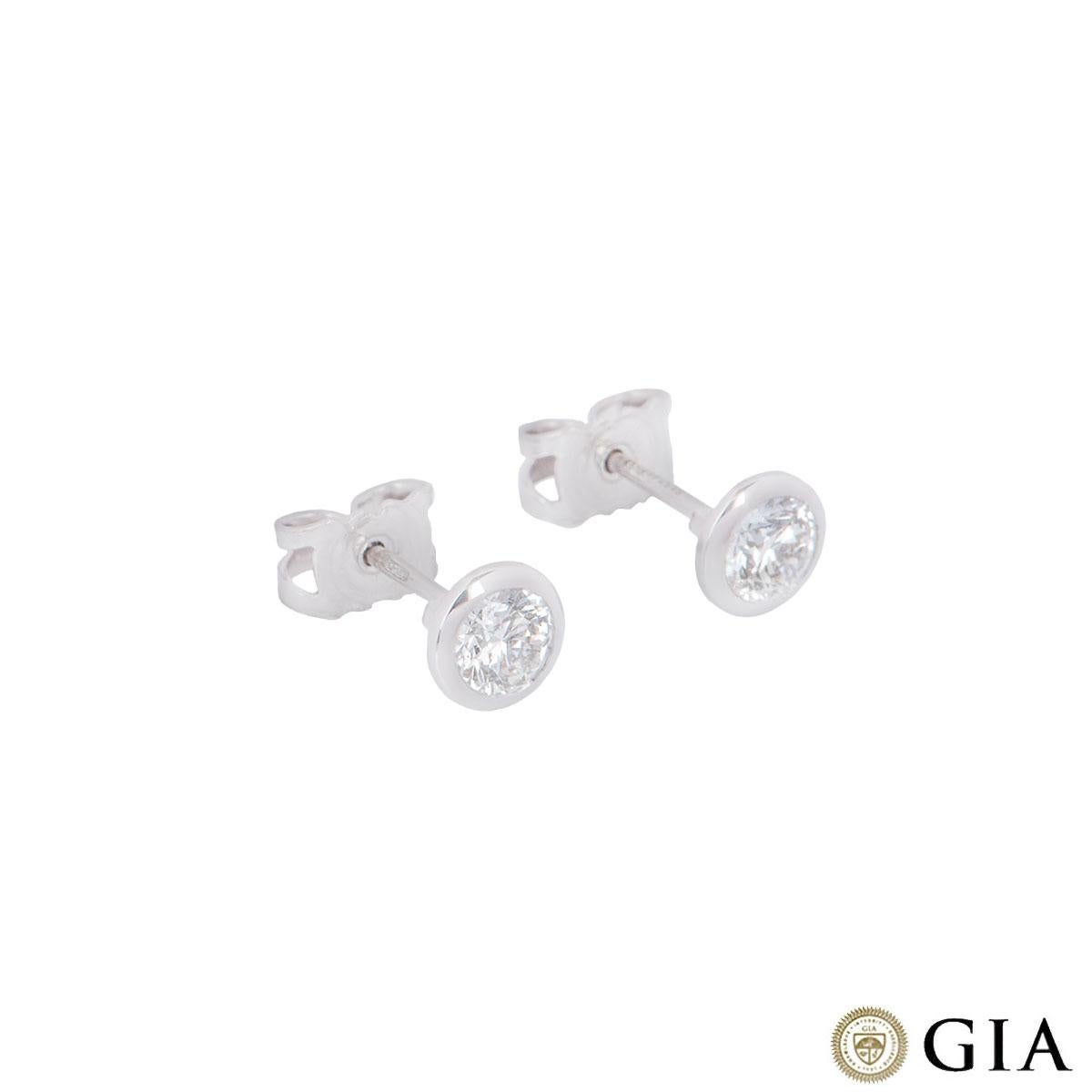 A stunning pair of 18k white gold diamond earrings. Each stud is set with a round brilliant cut diamond in a rubover setting. The first diamond has a weight of 0.37ct and the second weighs 0.38ct, both F colour and VS1 in clarity. The diamonds both