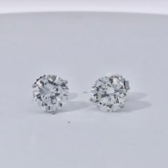 GIA certified Round brilliant cut Diamond Stud earrings weighing 4.12 ctw.