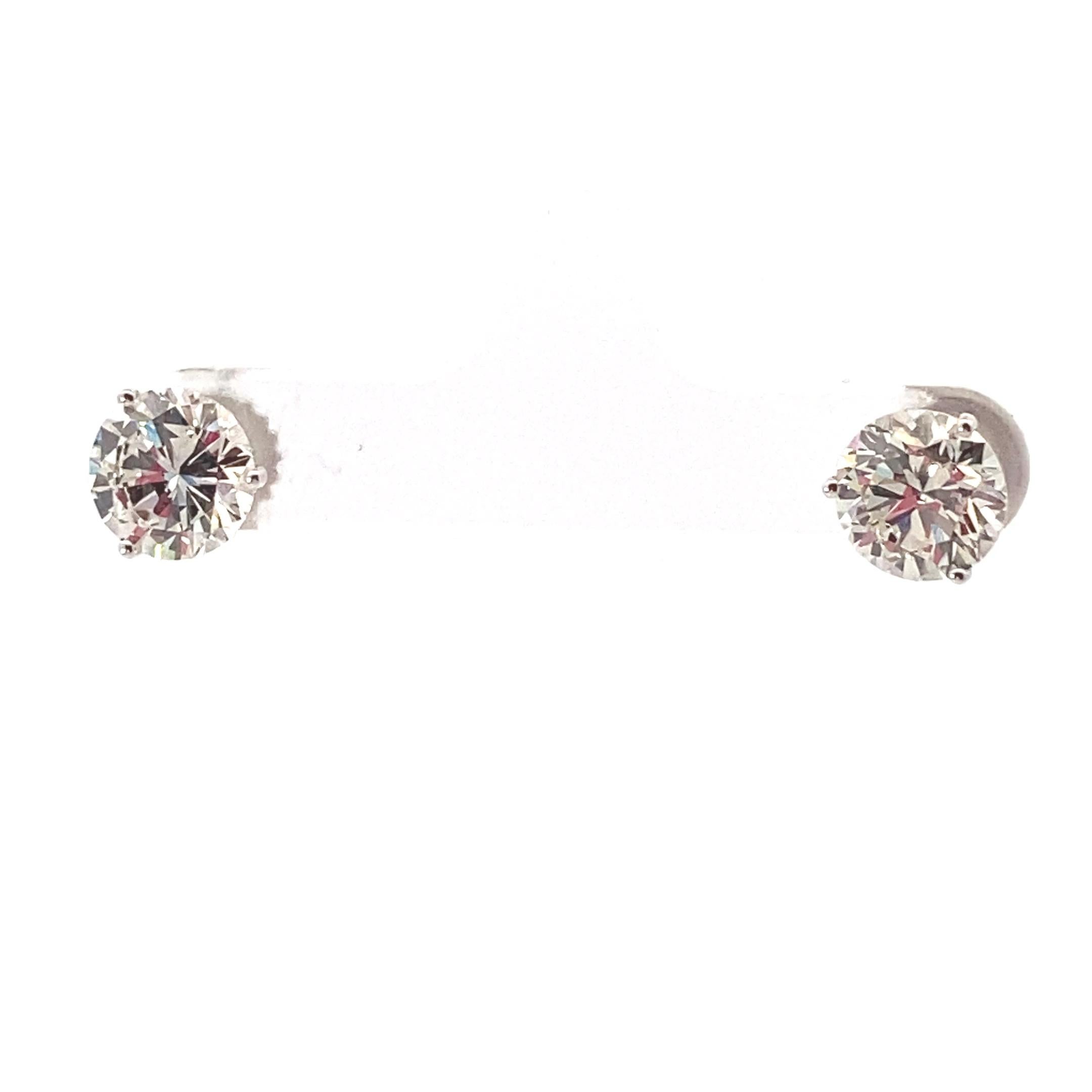 Round Cut GIA certified Round brilliant cut Diamond Stud earrings weighing 4.12 ctw. For Sale