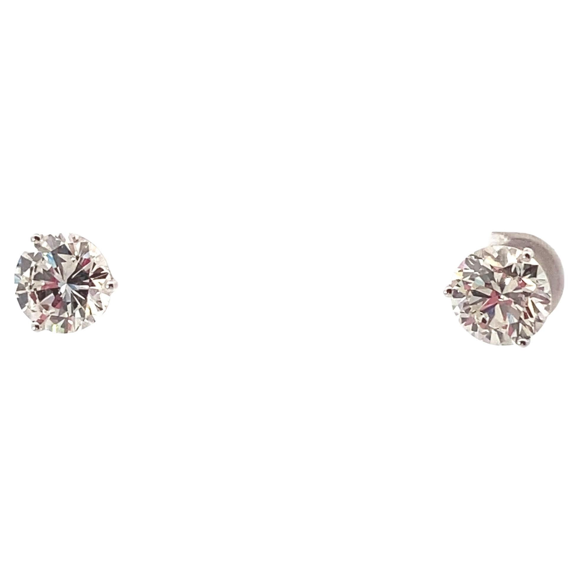 GIA certified Round brilliant cut Diamond Stud earrings weighing 4.12 ctw.
