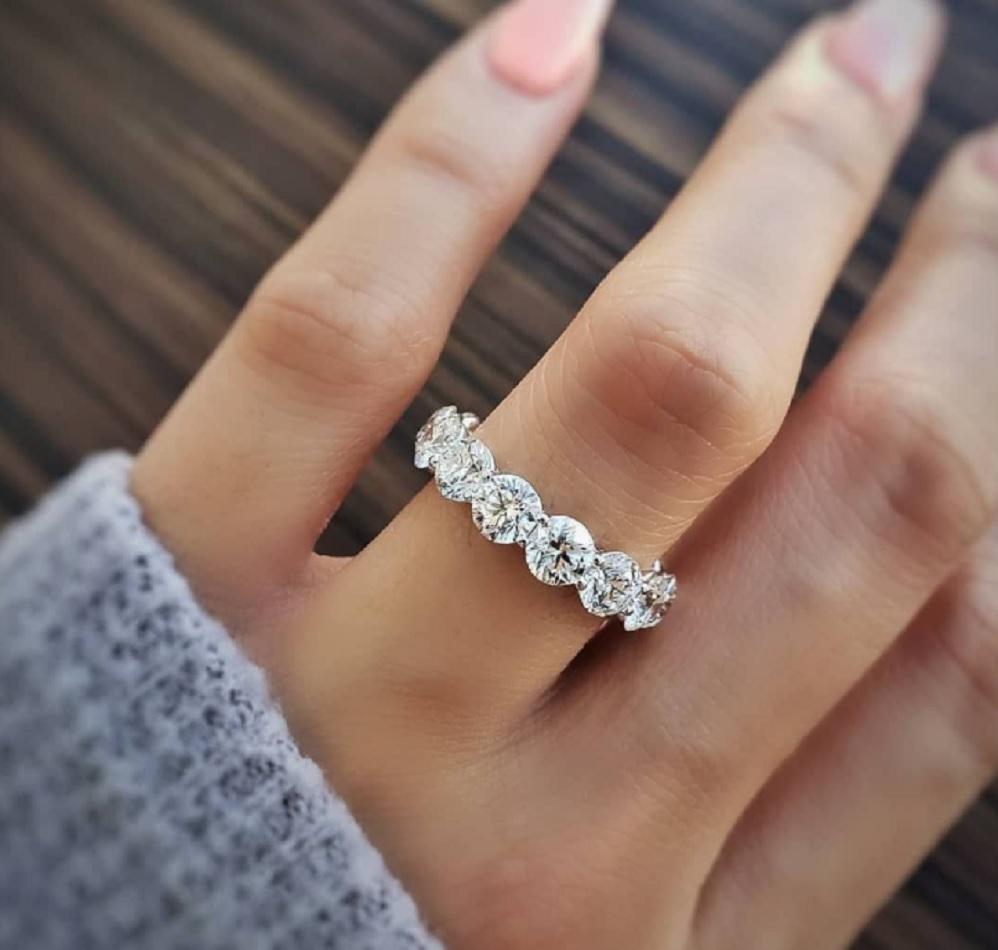 This Round Cut Diamond Eternity Band ring is breathtaking. Elegant and full of glamour. Round cut diamonds that goes all the way around is beautifully set on this shared prong design. This would be suitable for Wedding Bands, Anniversary or even