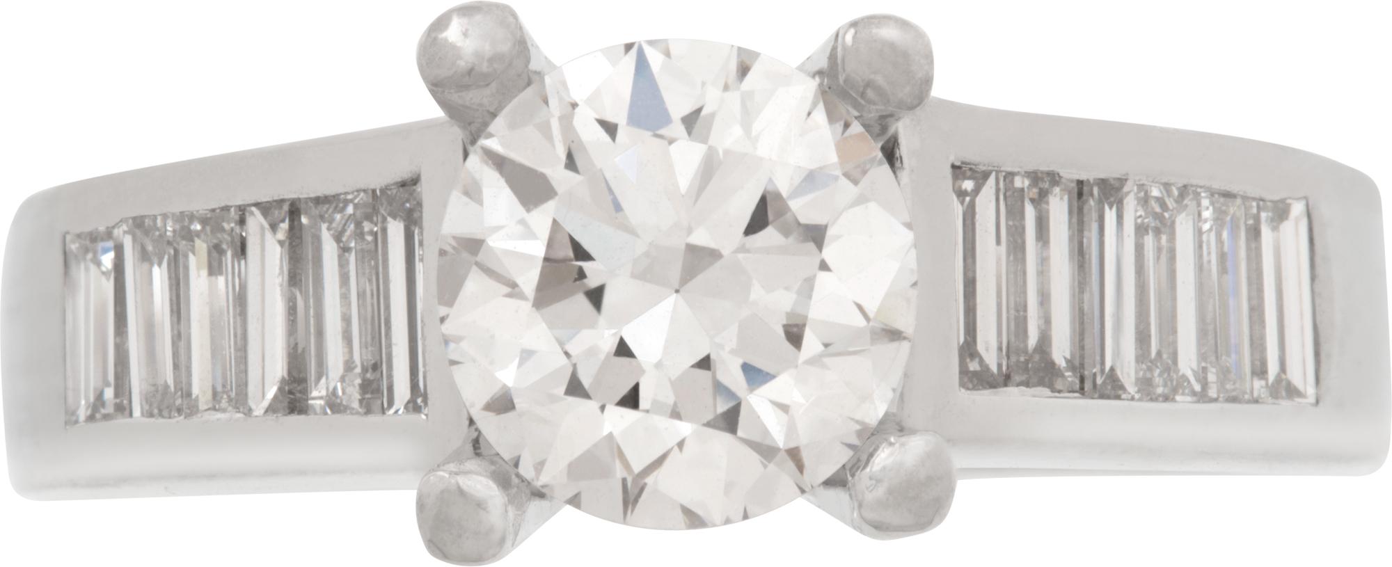 GIA certified Round Brilliant Cut natural diamond 1.14 ct. D color, VS2 clarity. Excellent polish. Platinum setting with 0.50 tcw in side baguette. Ring size 6.5

This GIA certified ring is currently size 6.5 and some items can be sized up or down,