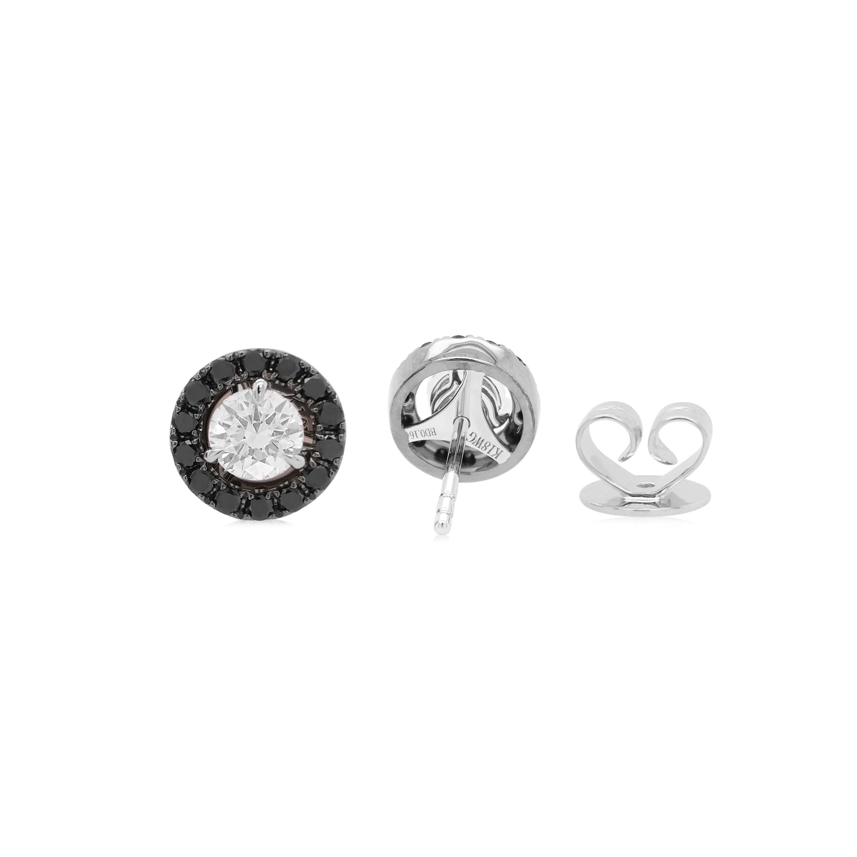 Pair of White Diamond Earrings with adjustable Halo of Black Diamonds, The dazzling white diamonds exude classic brilliance, while the bold black diamonds add a modern, edgy twis 

GIA Certified Round Brilliant Cut White Diamonds- 0.60 ct
Round