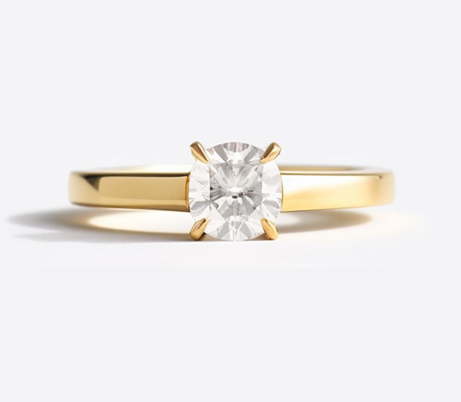 This engagement ring is crafted in 18 karat yellow gold and features a beautiful natural round cut diamond, 0,7 carats, J, SI2, Excellent, GIA certified. We use top-quality natural diamonds from a German gems company that has been in the market