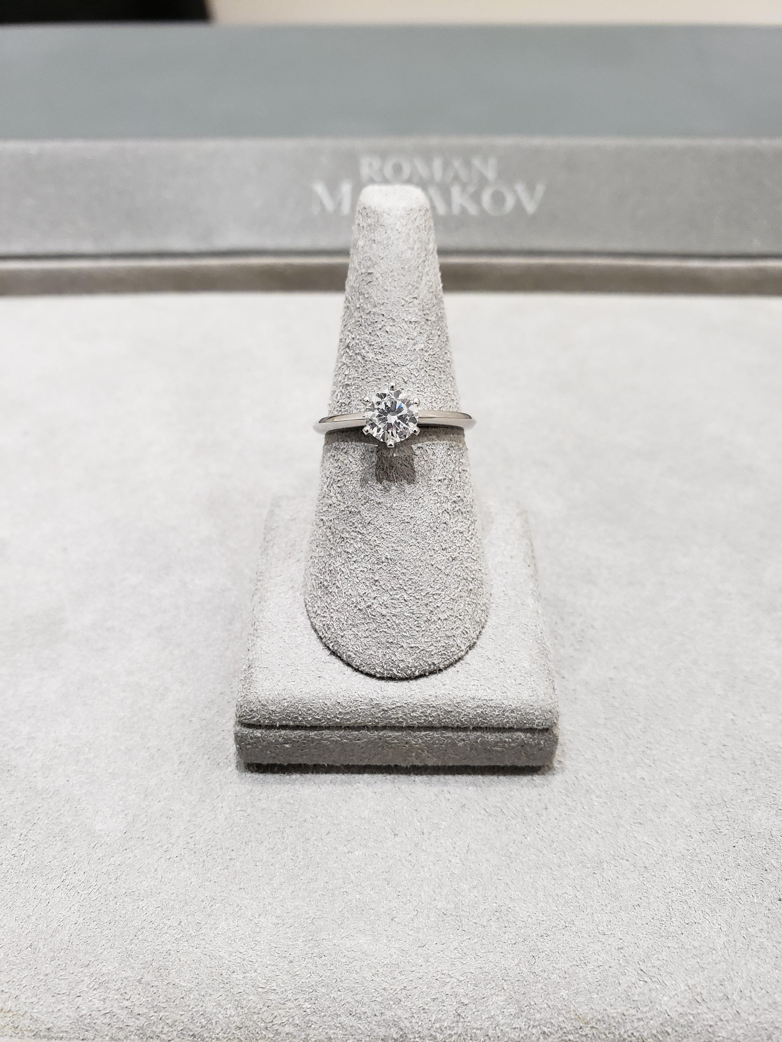 Features a 0.70 carat round diamond, certified by GIA as G color, SI1 clarity. Set in a 6 prong knife-edge style band made in platinum. Approximately size 6 US (sizable upon request).

Style available in different price ranges. Prices are based on