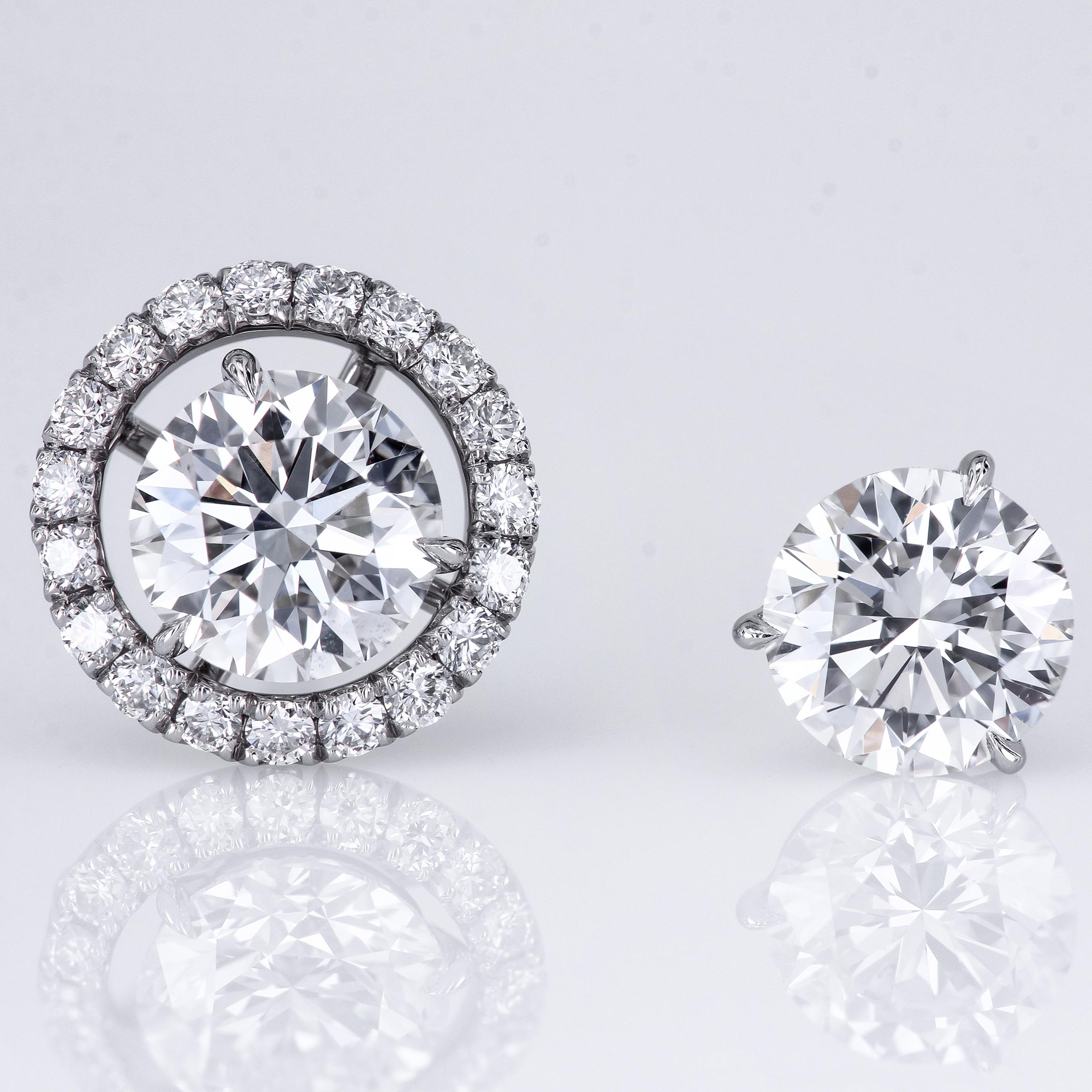 Leon Mege classic three-prong martini studs in platinum with removable micro-pave diamond jackets.

A pair of GIA-certified round diamonds 1.18 carats total weight: 
0.59 ct G/VS2 GIA #17384570
0.59 ct G/VS2;GIA #17376757

Studs are 5.3 mm in