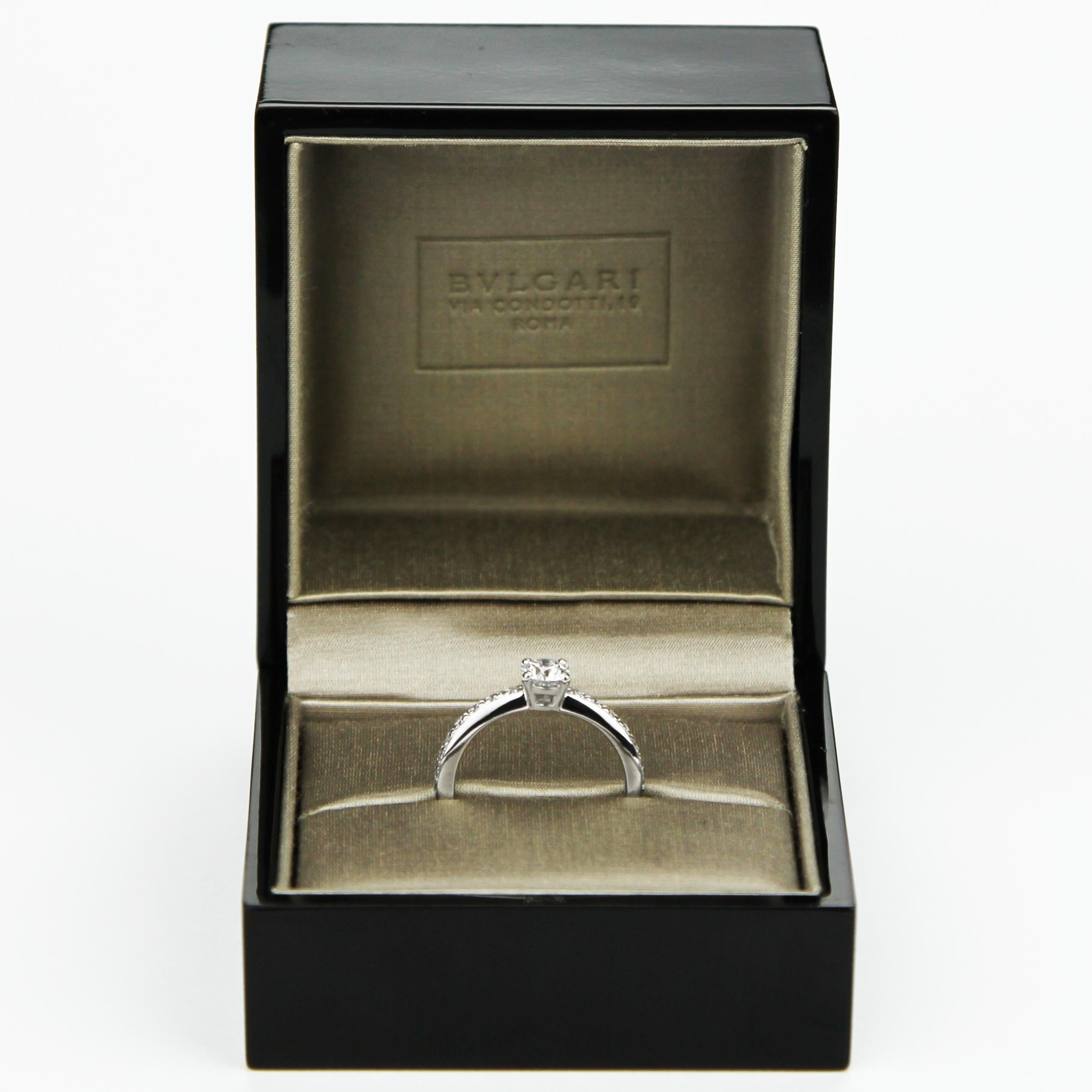 Bvlgari Griffe design, diamond solitaire ring set in platinum. Center diamond set with the best D colour and small sparkling diamonds on the shoulders. 
1 x Round Brilliant Cut Diamond, Laser inscribed girdle - 