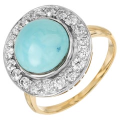 Anello da cocktail in oro platino con diamante aureolato e turchese rotondo certificato GIA