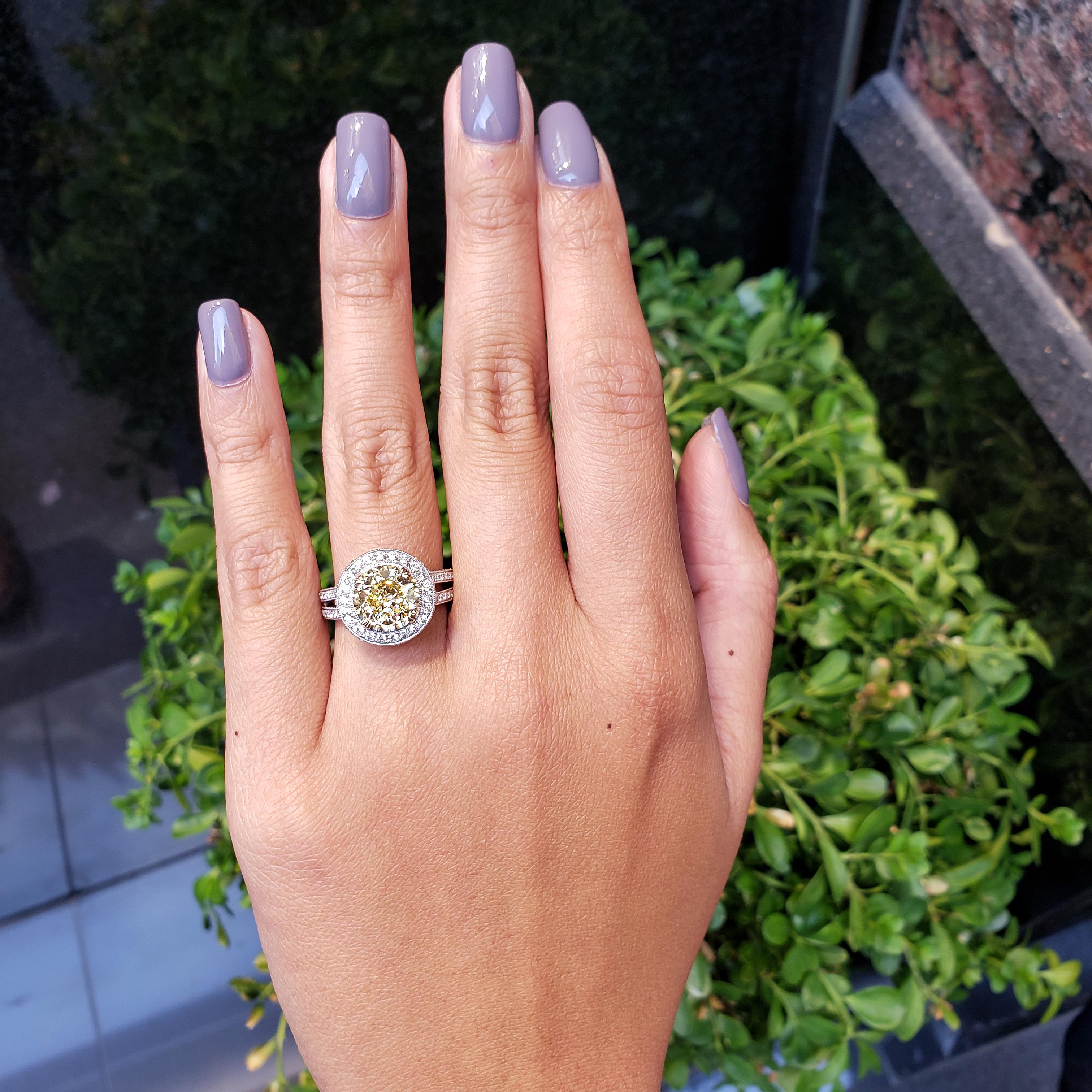 GIA Certified 3.08 Carats Round Fancy Yellow Diamond Halo Engagement Ring In New Condition In New York, NY