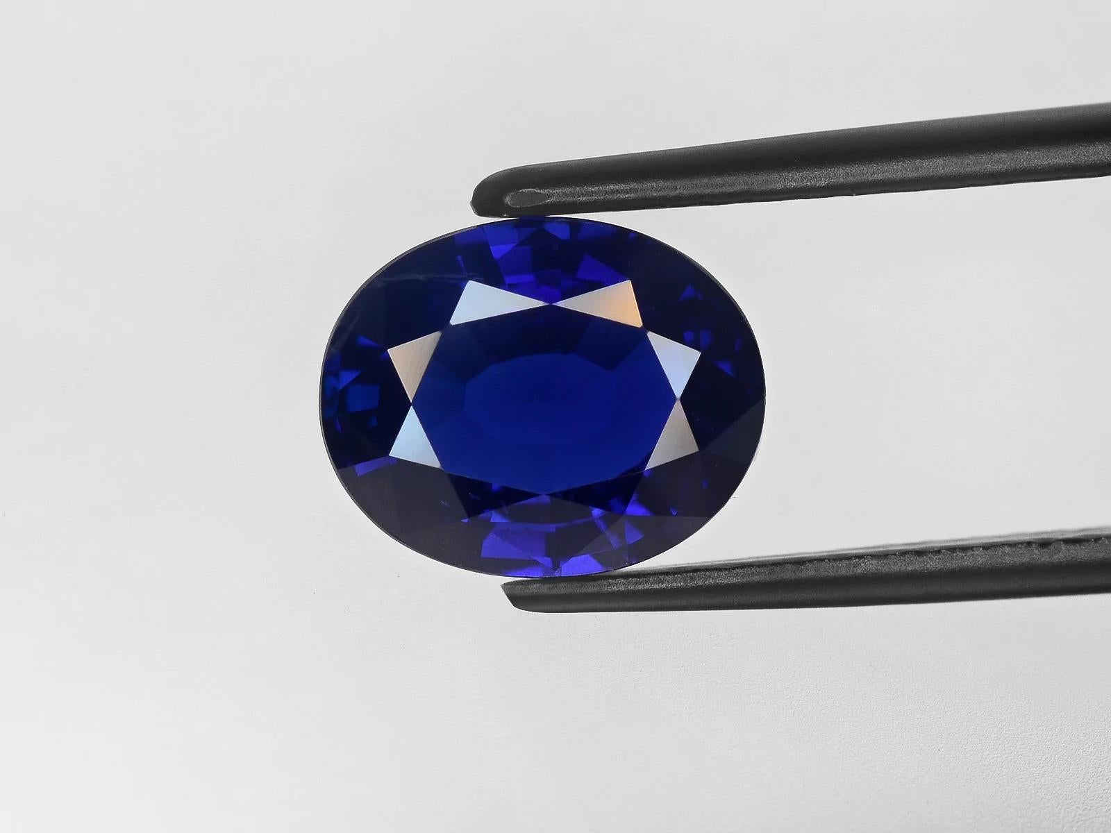 A very rare find. An extremely clean approximately vvs clarity natural oval royal blue sapphire certified by GIA of Kashmir origin
with two side trapezoid diamonds approx 1 carat in total vvs clarity f/e color

the ring has been made in Italy in