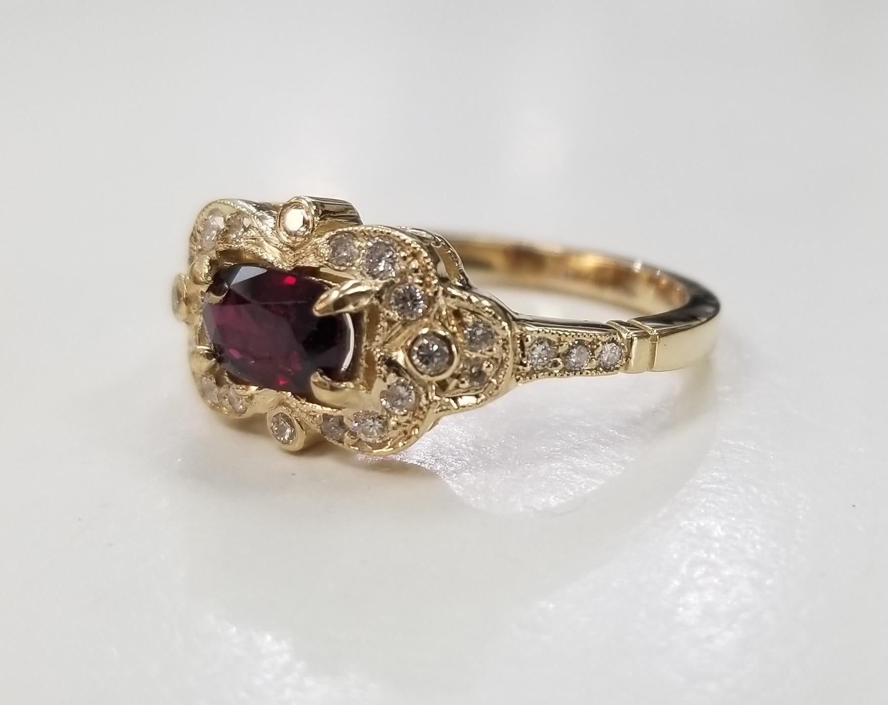 14 karat Art Deco Style Ruby and diamond ring, containing 1 step GIA Certified cut ruby weighing .83pts. and 26 round full cut diamonds of very fine quality weighing .27pts. This ring is a size 6.5 but we will size to fit for free.
