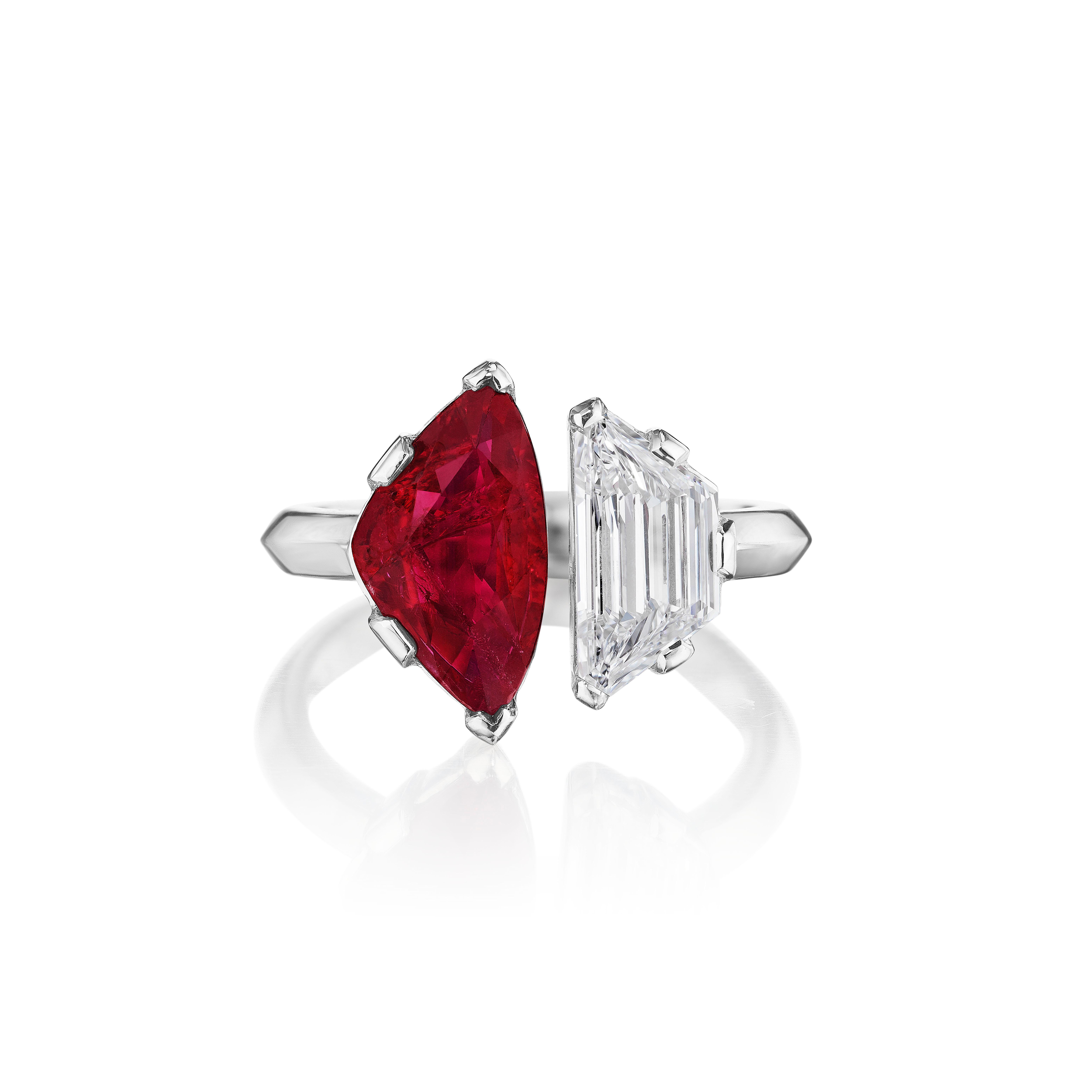 Beautiful Toi et Moi Ring featuring an unusual Triangular Ruby weighing 2.22 Carats complimented with a Trapezoid Cut Diamond weighing 1.01 Carats.
Ruby is Certified by GIA.
Diamond Certified by GIA as D color and SI1 clarity.
Set in Platinum.
Size