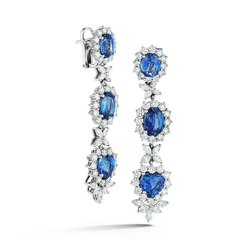 Vibrant 11.72 ct. sapphires and 5.25 ct. diamonds in a perfect drop earring. 18k White Gold. GIA Certified.