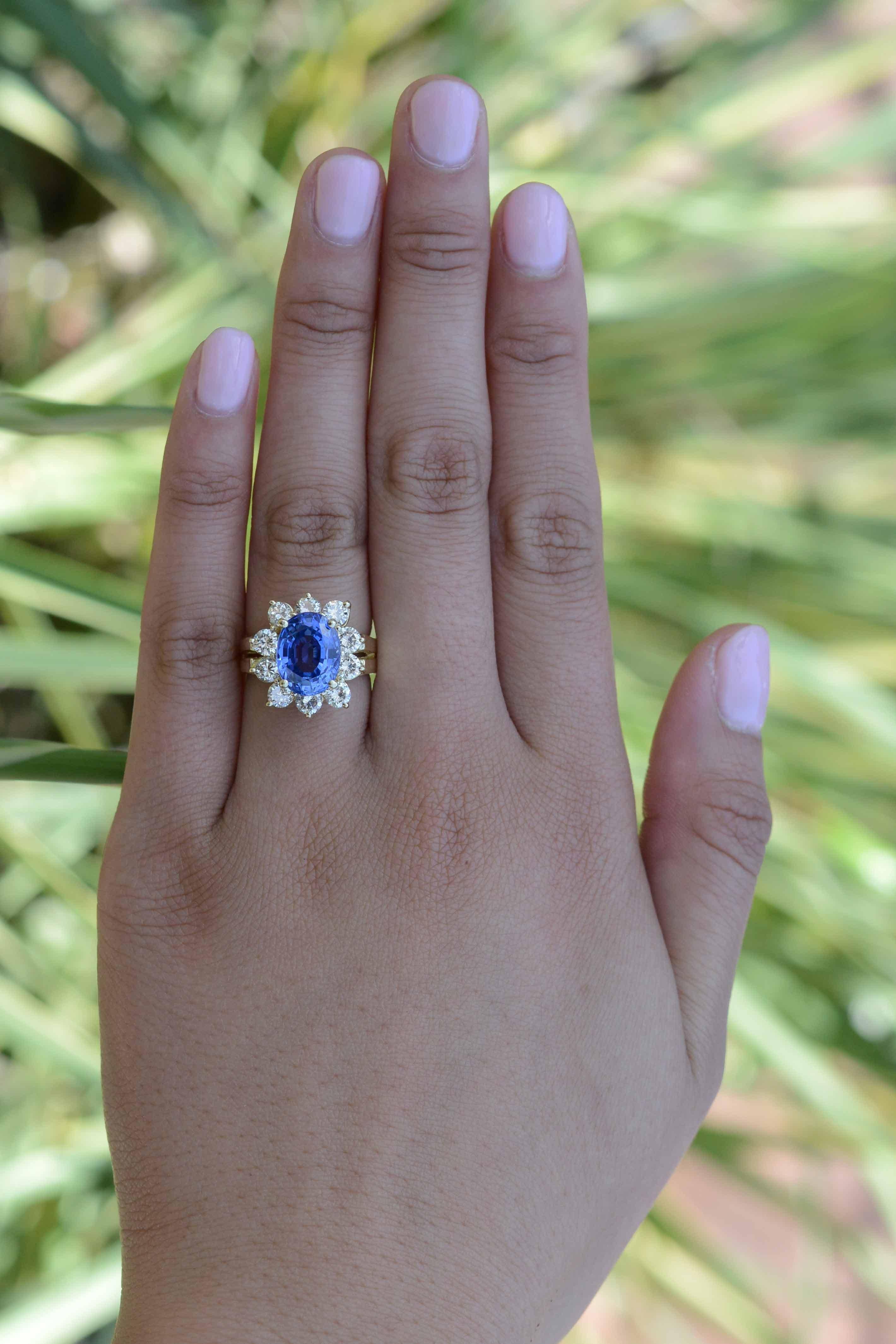 This GIA certified 4.64 carat sapphire and diamond ring is the ultimate symbol of everlasting love. The style reminiscent of the Princess Diana engagement ring showcases a velvety-blue, deeply saturated, sparkling Ceylon sapphire. Coupled with 1
