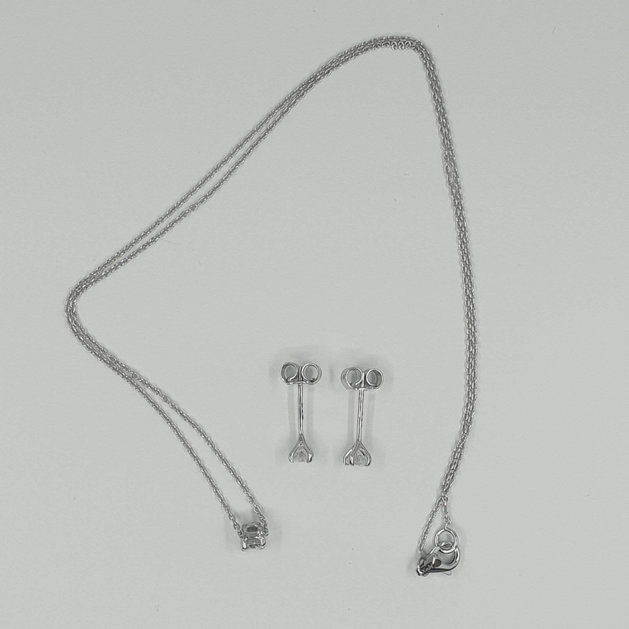 Boucles d'oreilles et collier solitaires en diamants certifiés GIA de 0,63 carat G/SI1 en vente 7