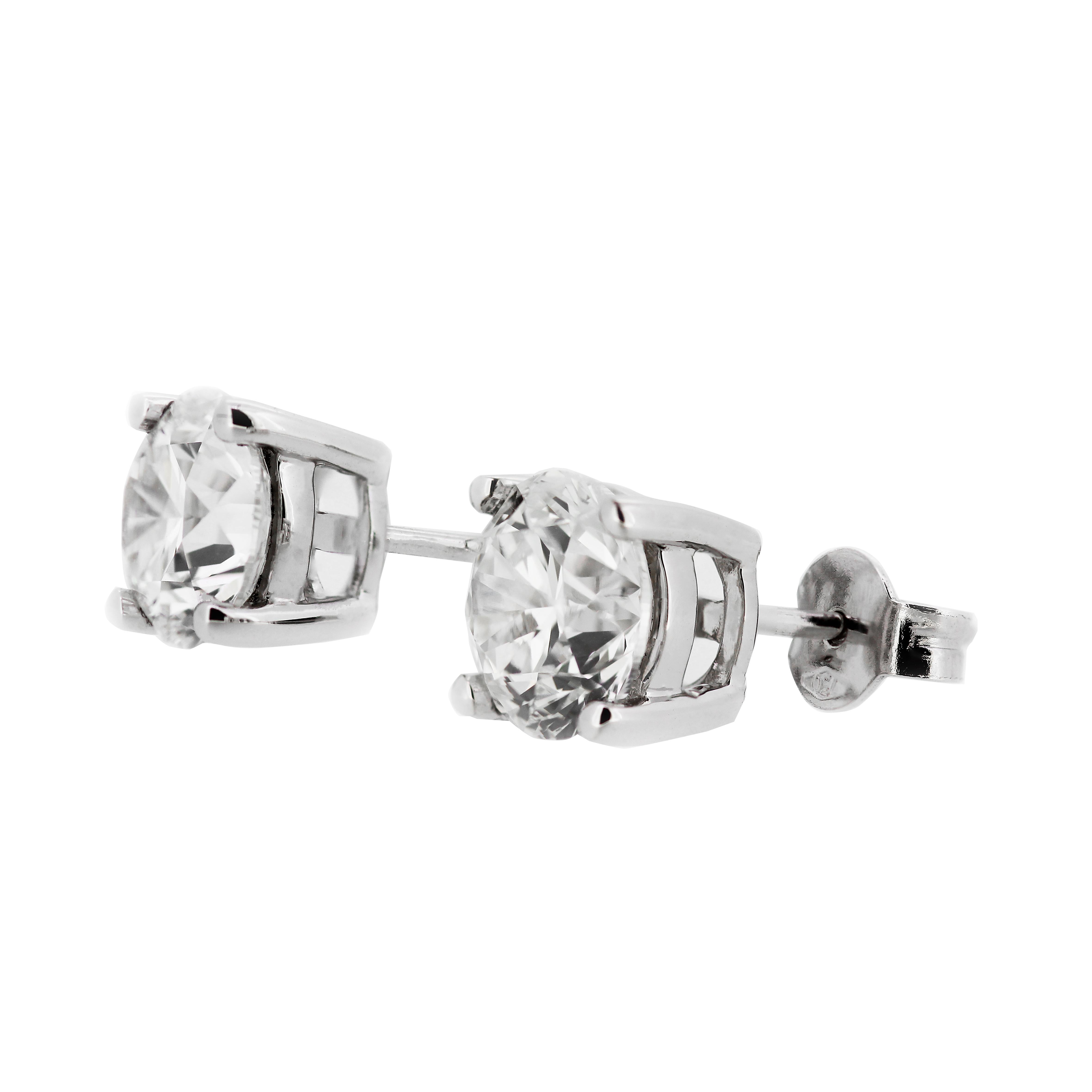 A sparkling pair of solitaire diamond stud earrings meticulously matched for size, colour and clarity. Elevate your ears to a new level of elegance with these exceptional GIA-certified diamond ear studs, each featuring 2 GIA-graded round brilliant