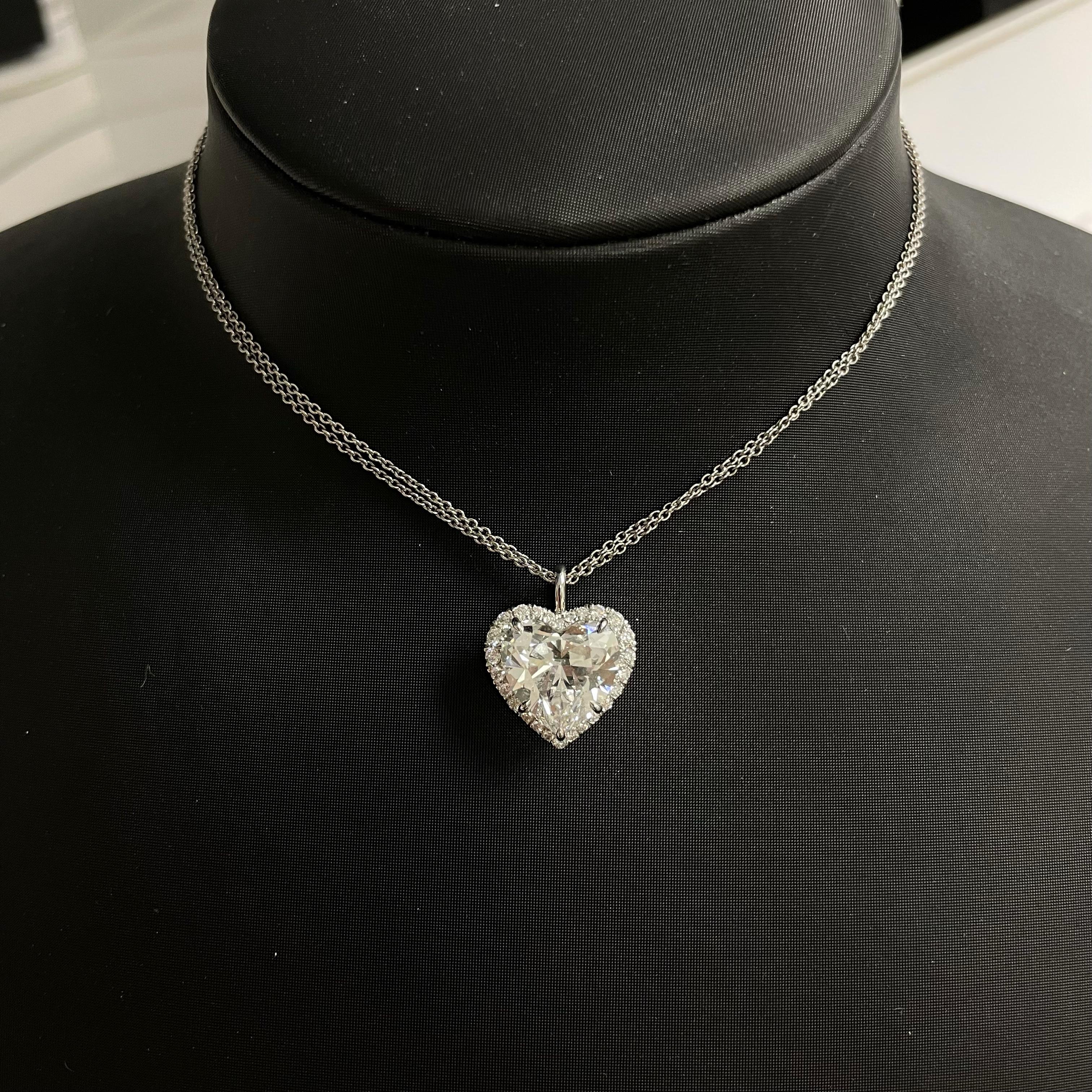 A bright and sparkly 5.02CT HEART SHAPE, E, VS1

set in Platinum 

with 26psc = 0.32cttw diamonds melee, 

GIA #2151768209