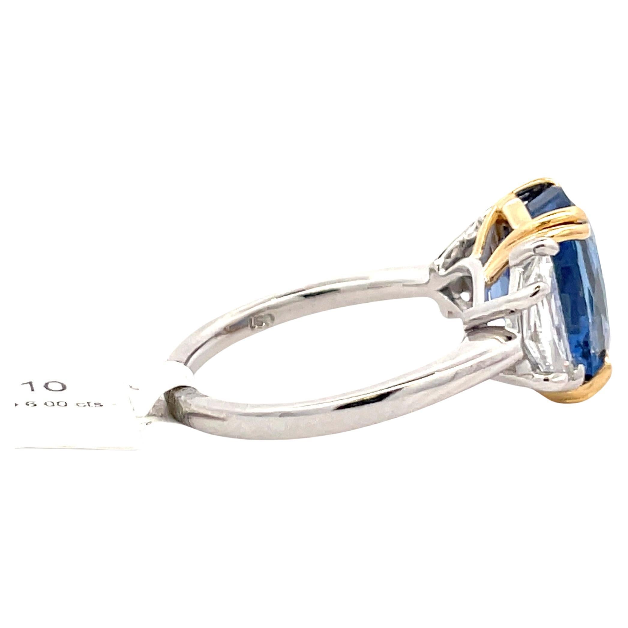 GIA Certified Sri Lanka cushion Sapphire weighing 6 Carats flanked with two Cadillac diamonds weighing 1.10 carats crafted in Platinum & 18 Karat yellow gold. 