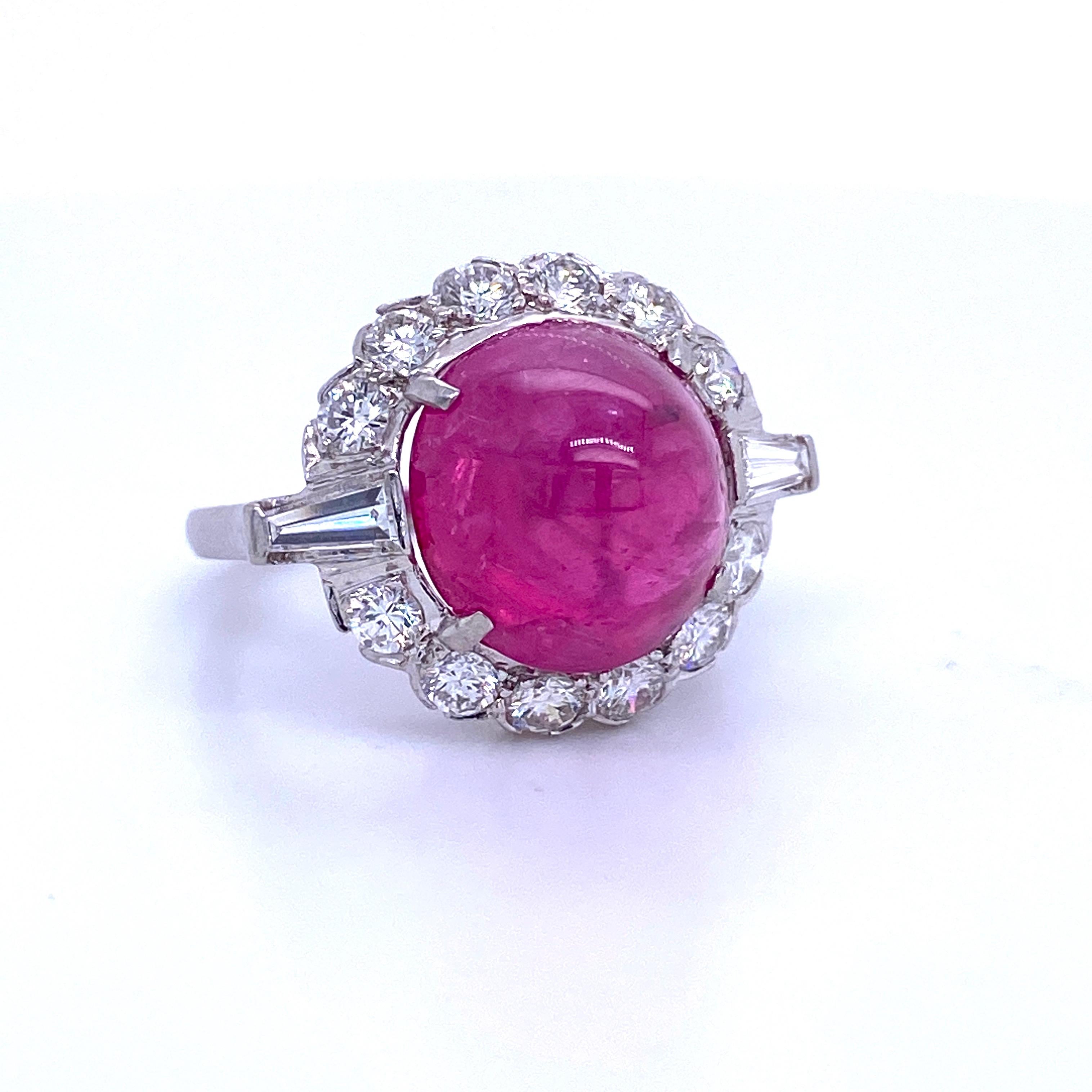 Platinum cocktail ring featuring one GIA Certified Sugar Loaf Ruby weighing 10.42 carats flanked with round brilliants and baguettes weighing 1.50 carats. No Heat!
Color G
Clarity SI