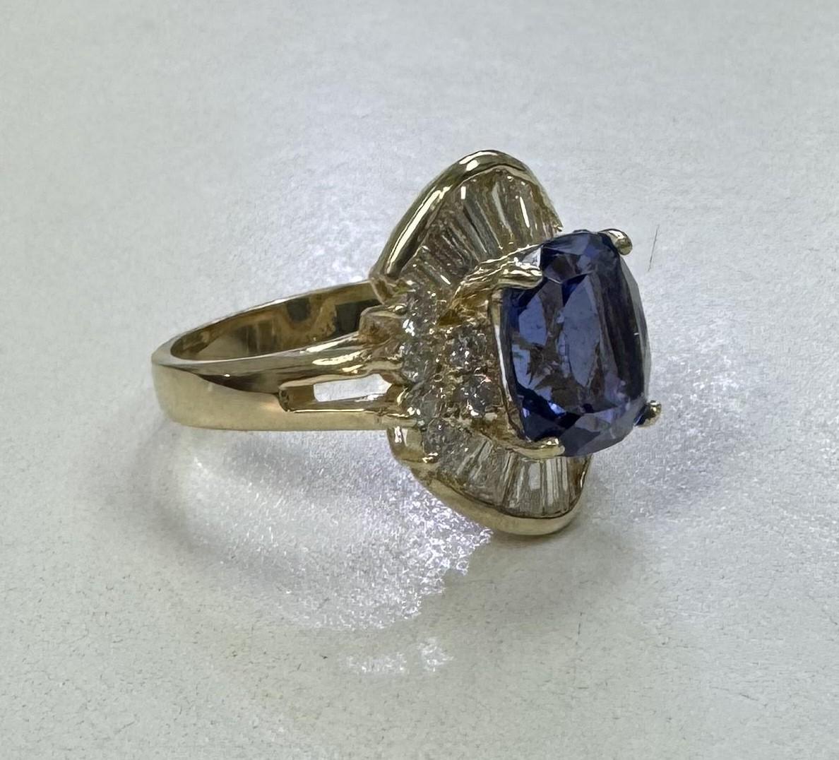 Specifications:
*Motivated to Sell - Please make a Fair Offer*
    main stone: GIA Certified Tanzanite Cushion-cut 
                       3.68ct.  A-Quality 
    diamond: 14Tapper Baguette cut diamonds and 
                     rounds total weight