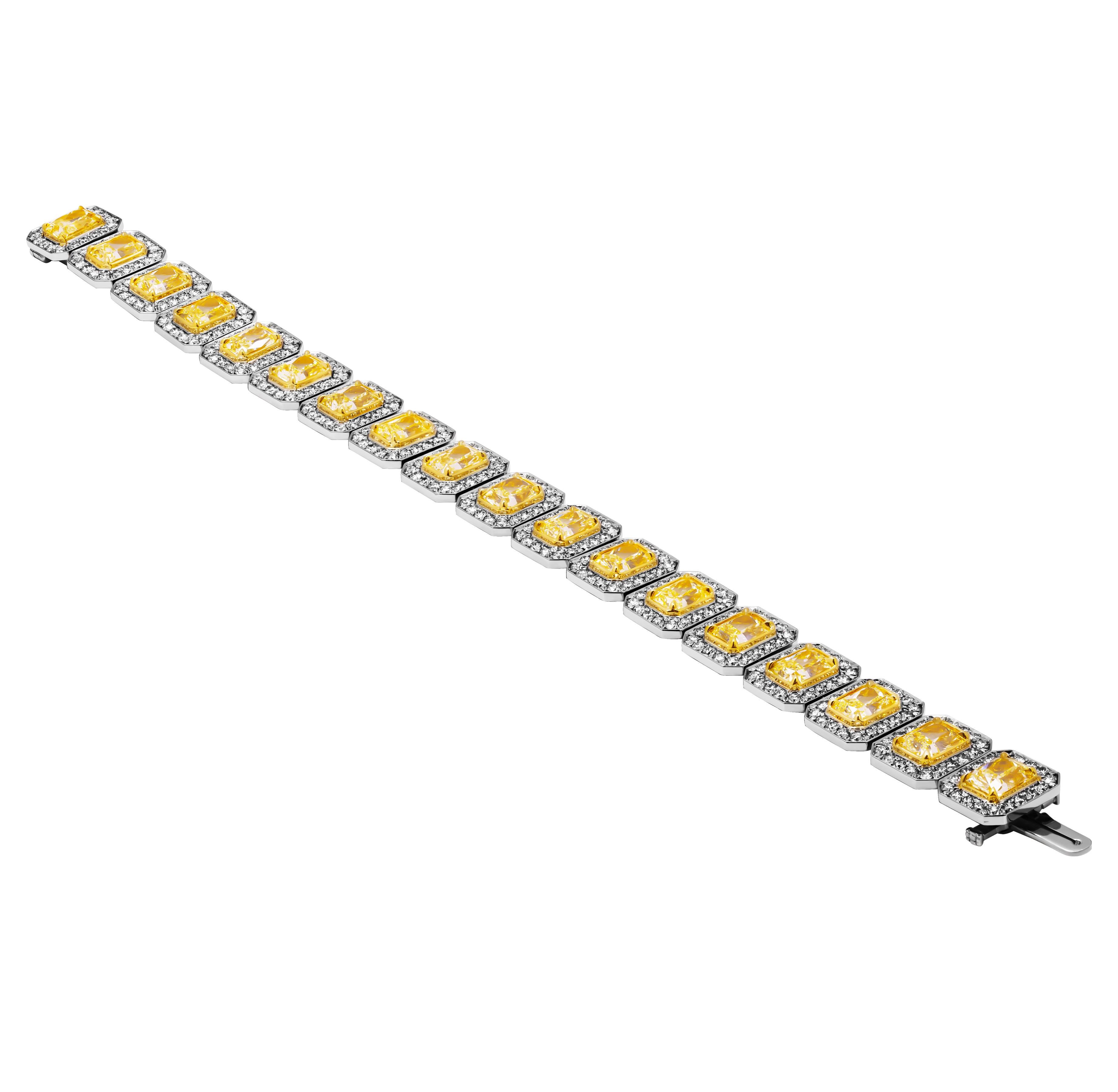 Bracelet de tennis en platine et or jaune 18k 
Avec un halo en pavé autour de chaque pierre totalisant 5.43ct 
7in long 
Avec 18 diamants de taille radieuse naturelle classés de Y à Z
1,20 VS1 GIA#7486667685 
1,08 VVS1 GIA#1465725044 
1,02 VS2