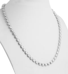 Collana Tennis certificata GIA con diamanti taglio smeraldo incastonati a est-ovest