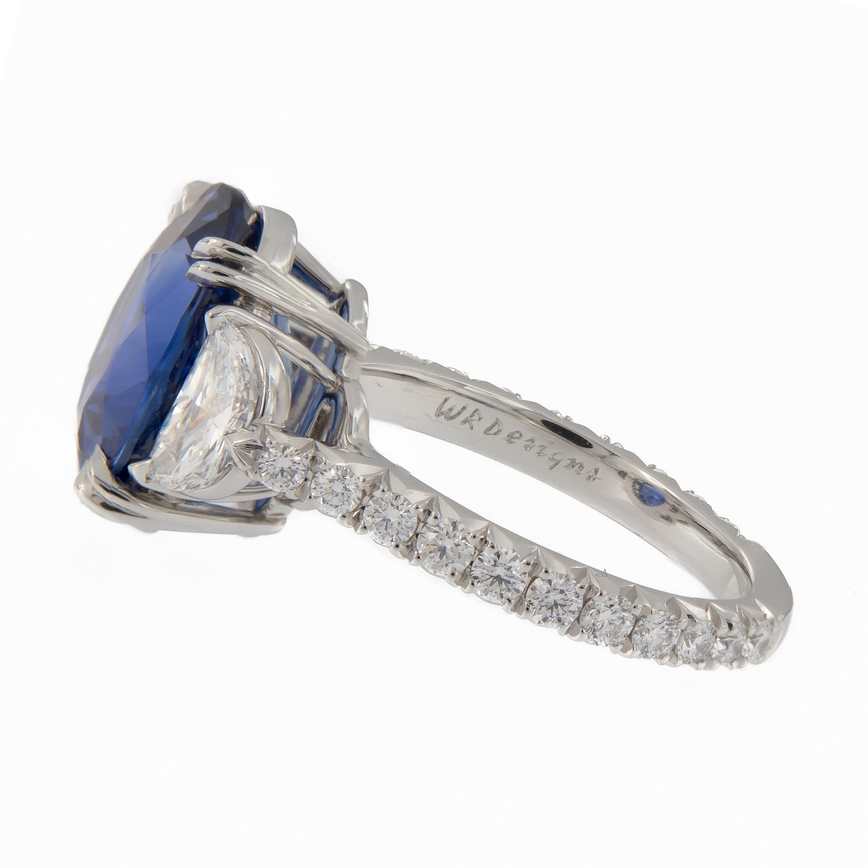 Stunning 6.72 carat oval blue sapphire and two D VS half-moon modified cut diamonds make up this beautiful 3-stone platinum ring. Additional round diamonds sparkle along the ring’s band. Ring Size 6.25. Weighs 8.4 grams

Sapphires 6.72 cttw
Half