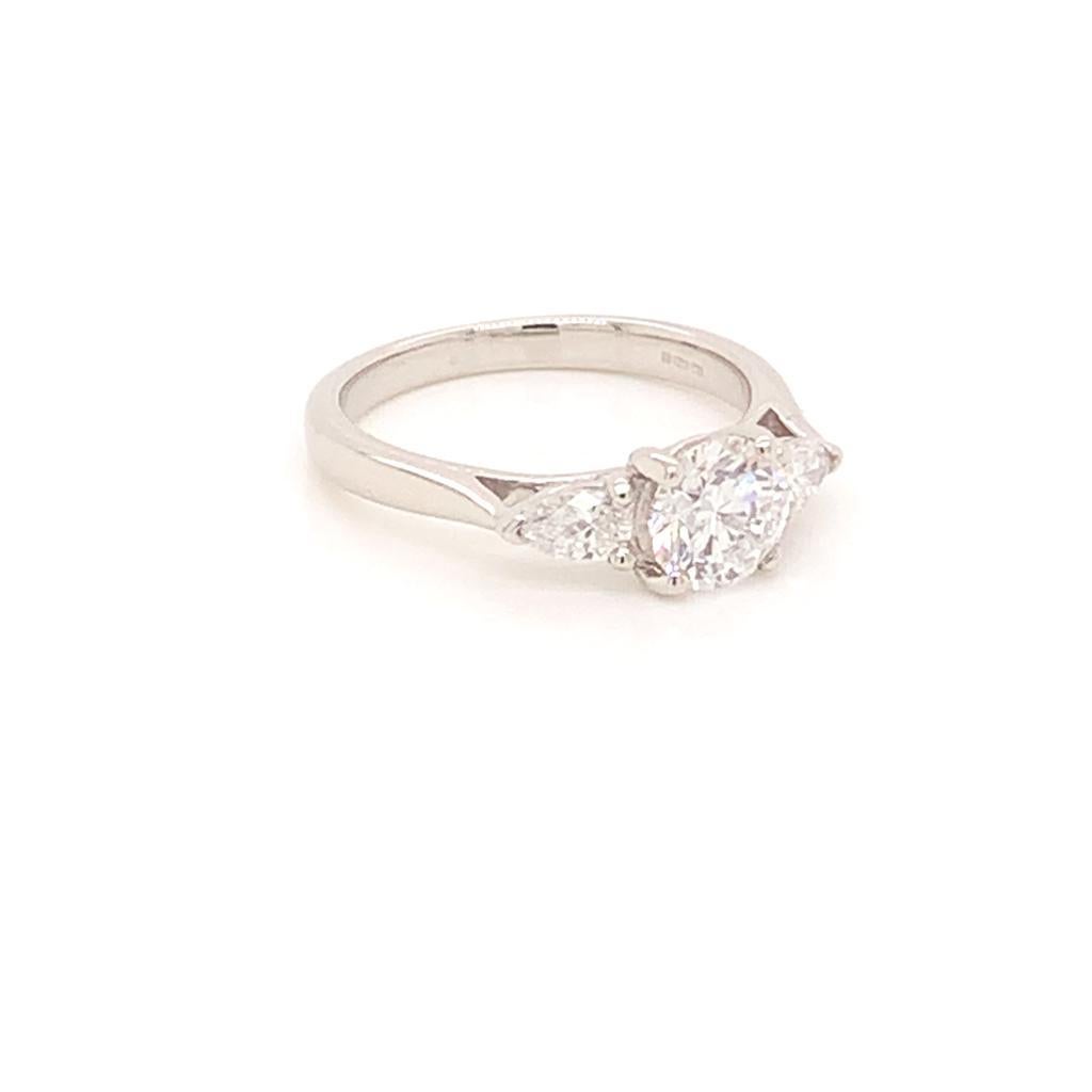 Round Cut GIA Certified Three-Stone Diamond Ring in Platinum For Sale