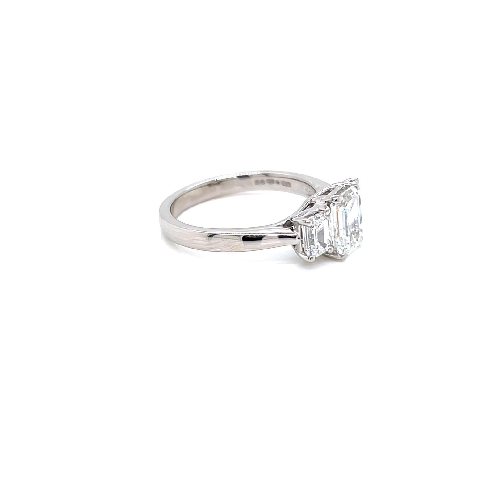Contemporary GIA Certified Three-Stone Emerald cut Diamond Ring in Platinum For Sale