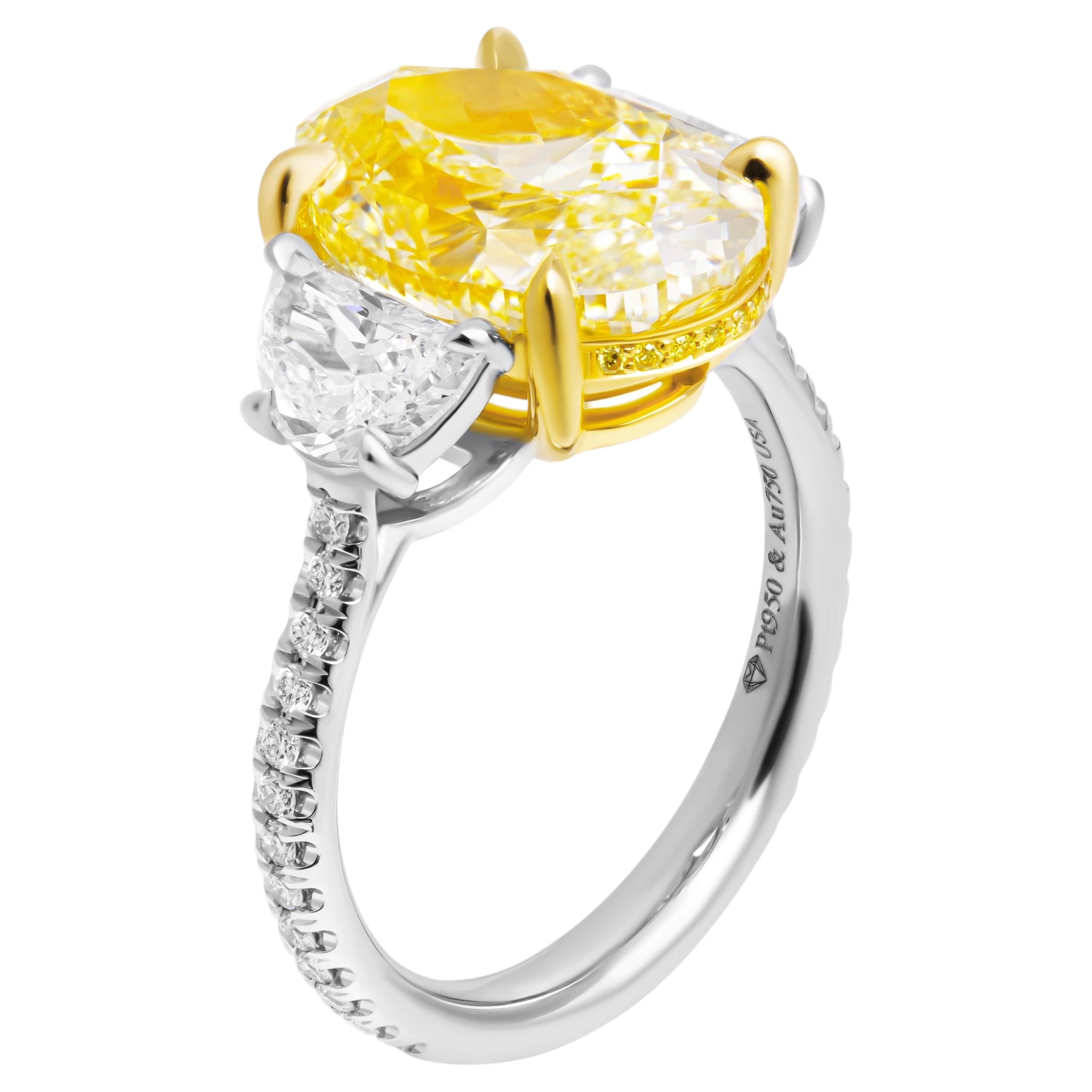 GIA Certified Three-Stone Ring with 6.02ct Fancy Light Yellow VS1 Oval