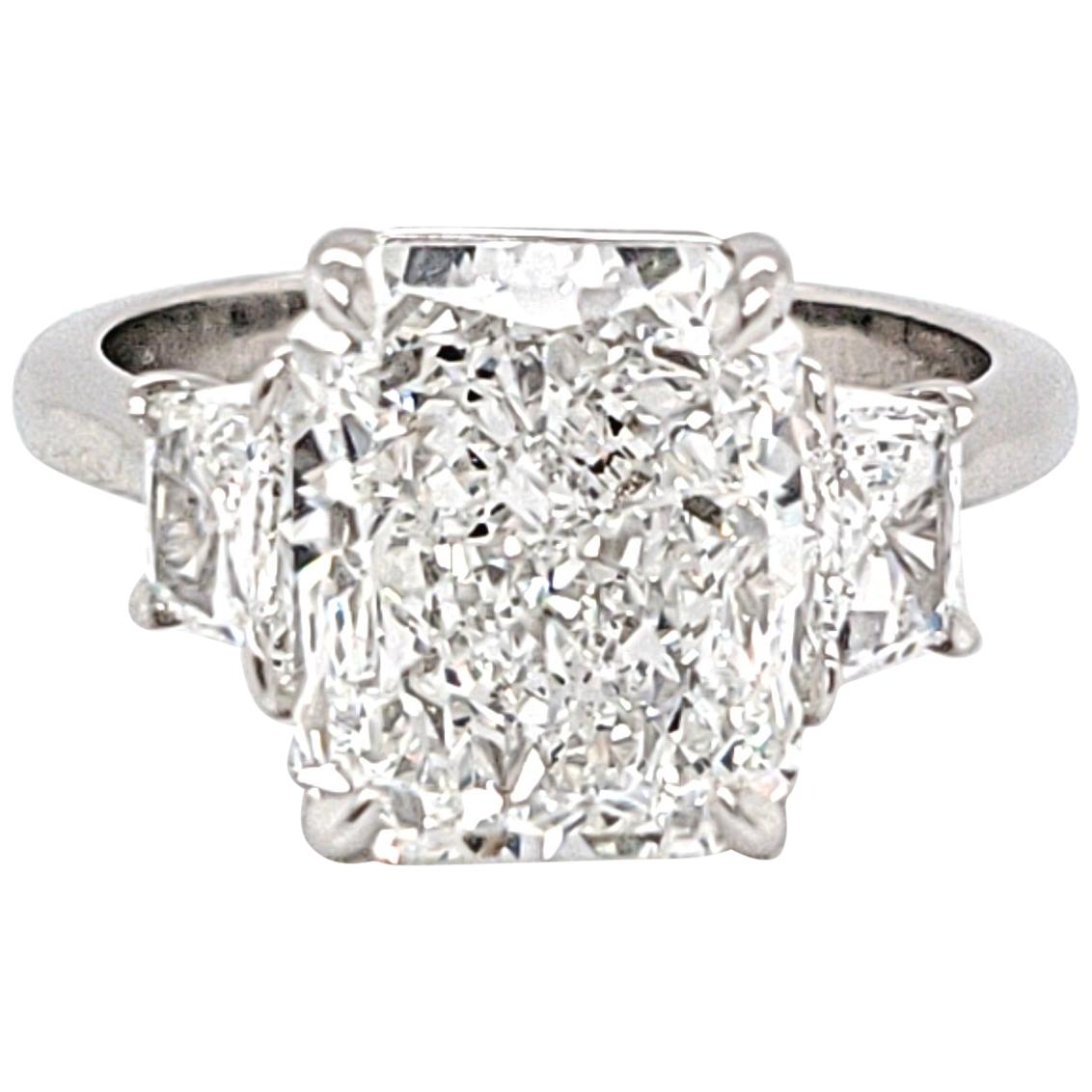GIA Certified Three-Stone Ring with a 4.40 Carat Radiant Cut Center