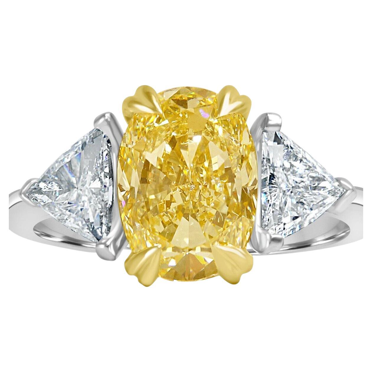 GIA Certified Three Stone3.93 Carat Oval Cut Light Yellow Diamond 18k Gold Ring  For Sale
