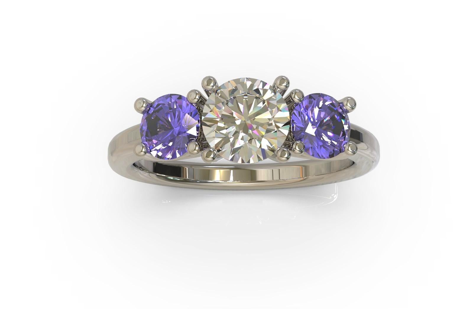 Ring with a trio of gemstones

Centrally set within a round brilliant cut  diamond displays a beautiful vitreous lustre. Two purplish blue Ceylon sapphires are similarly set on either side. Simply gorgeous.
Round brilliant cut diamond: 
1= D colour,