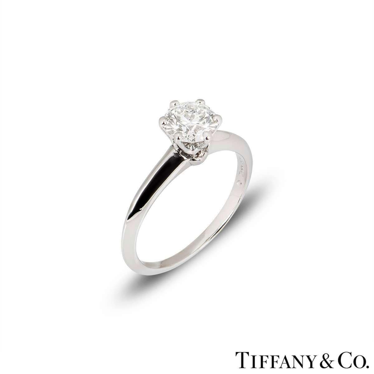 A beautiful platinum diamond ring by Tiffany & Co. from The Setting collection. The ring comprises of a round brilliant cut diamond in a 6 claw setting with a weight of 1.05ct, G colour and VS1 clarity. The ring has a gross weight of 4.8 grams and