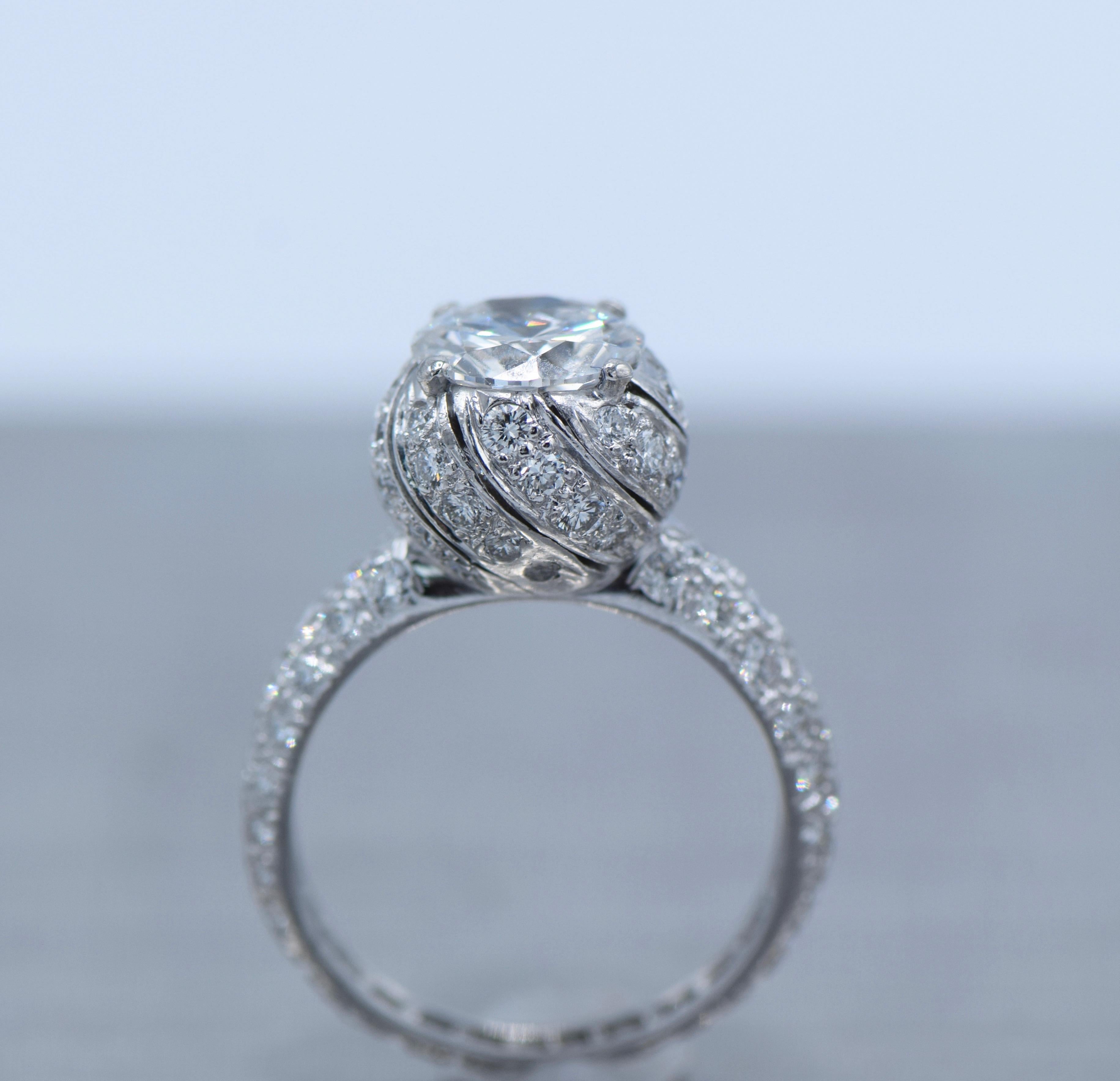 Tiffany & Co. Schlumberger Platinum Engagement diamond ring 

GIA certified Center diamond weight: 1.63 Carat 

Color: E

Clarity: VS2 

mounted in round cut brilliant diamond weight: apx 1.5 Carat 

Size: 6-6.25