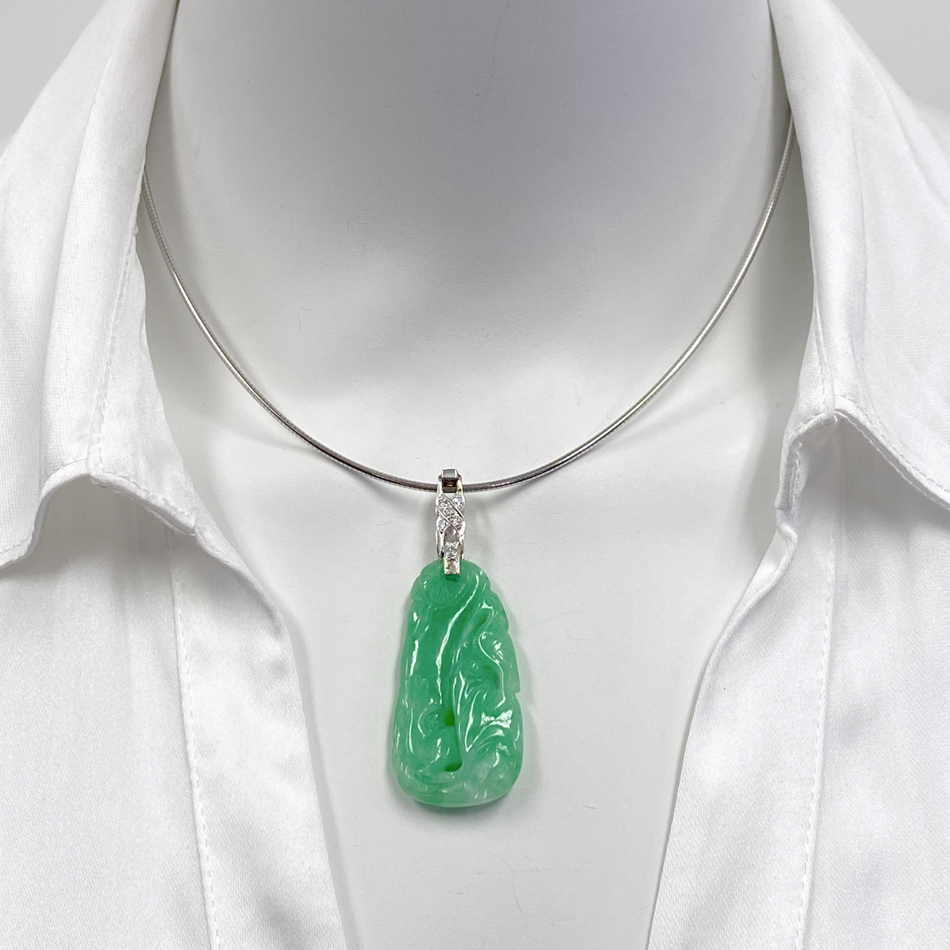This jade pendant features a crane, a Chinese symbol of peace and longevity.  Here, the crane is posed under a tree next to a reclining deer, who gazes at the crane with friendly interest.  This is a popular motif for conveying a prolonged life. 
