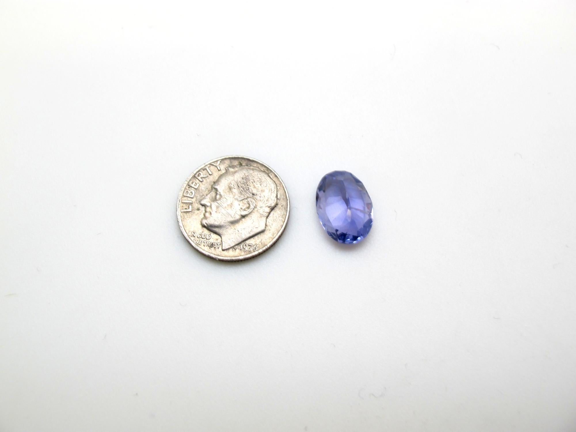 This is a very clean and bright sapphire with a violetish blue color. It measures 12.39 x 8.81 x 5.55 millimeters and weighs 4.67 carats. It is accompanied by Gemological Institute of America Report #2201169943 that states that it is unheated. The
