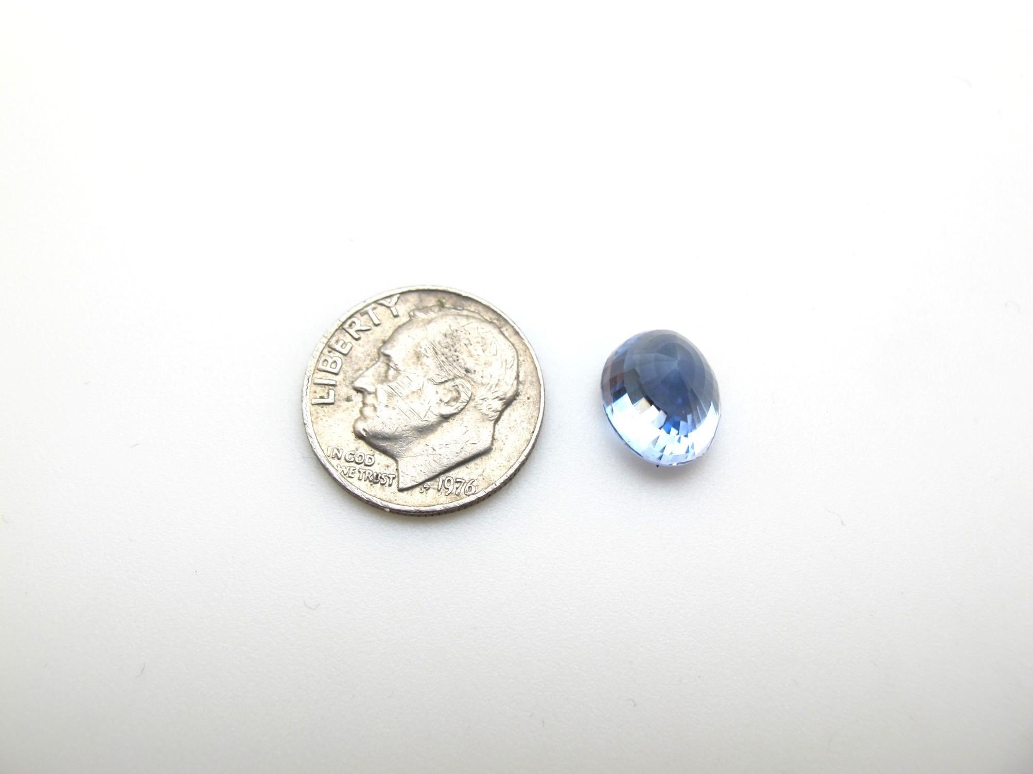 This loose sapphire is a gem quality piece! It is a lively cornflower/powder blue color, free from eye visible inclusions and brilliantly cut.  It measures 10.42 x 8.79 x 8.03 millimeters and weighs 6.36 carats unmounted. It is accompanied by