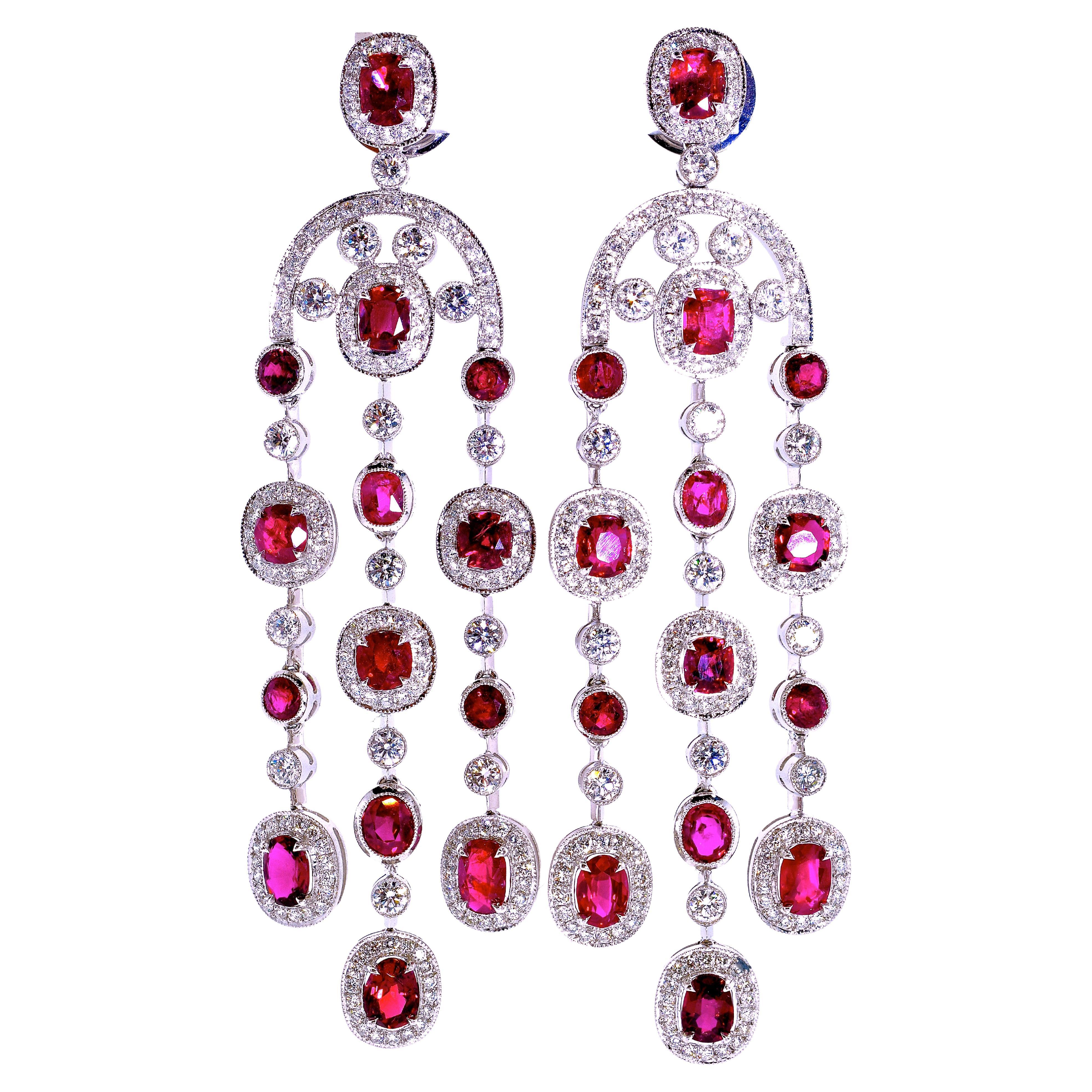 Unheated Natural Rubies set in platinum chandelier earrings, these vivid red rubies possessing GIA certificates which state that the fine matched rubies are unheated and untreated. There are 10.29 cts of fine vivid red rubies in 28 round well cut