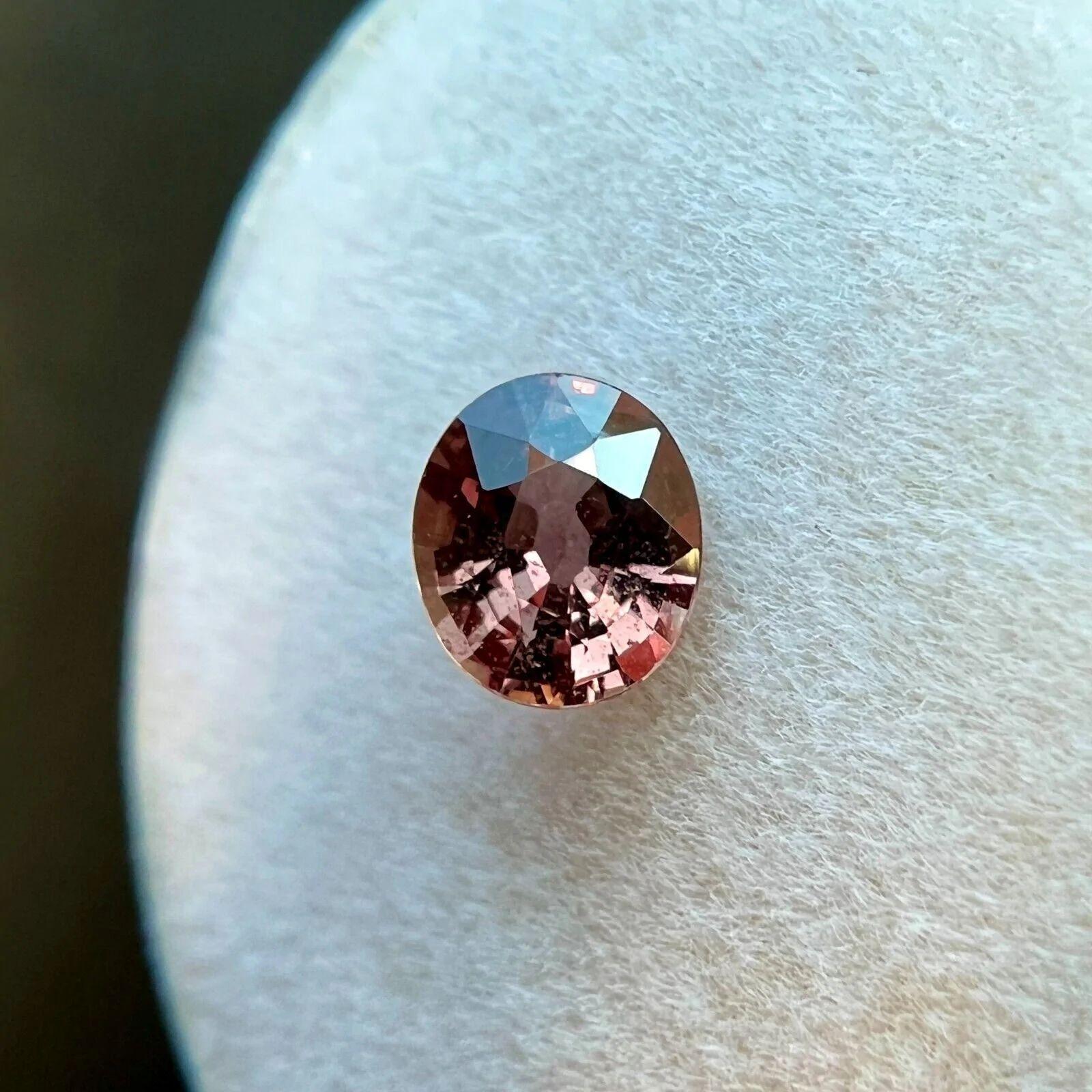 Women's or Men's GIA Certified Unique Orange Pink Unheated Sapphire 0.75ct Oval Cut Gem No Heat For Sale