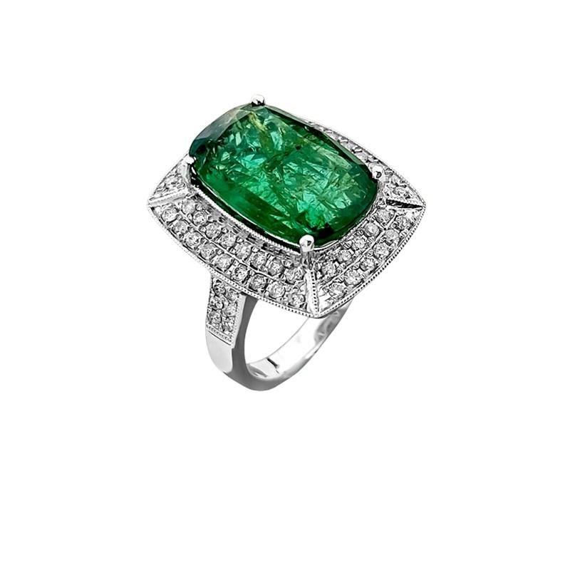 Elevate your style with this stunning modern ring crafted from 14K white gold, featuring a captivating 7.25 carat cushion-cut emerald and 1.50 carats of VS clarity, F color diamonds. Both the diamonds and emerald are 100% natural earth mined,