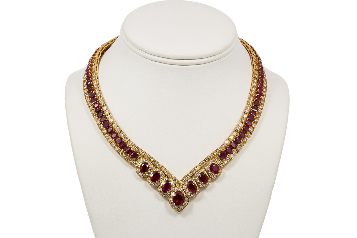 We are pleased to offer this GIA Certified Vintage 18k Yellow Gold Diamond & Ruby Graduated Necklace. This stunning vintage estate piece is finely crafted from 18k yellow gold and features approximately 34.00ctw oval cut rubies, 87 stones in total