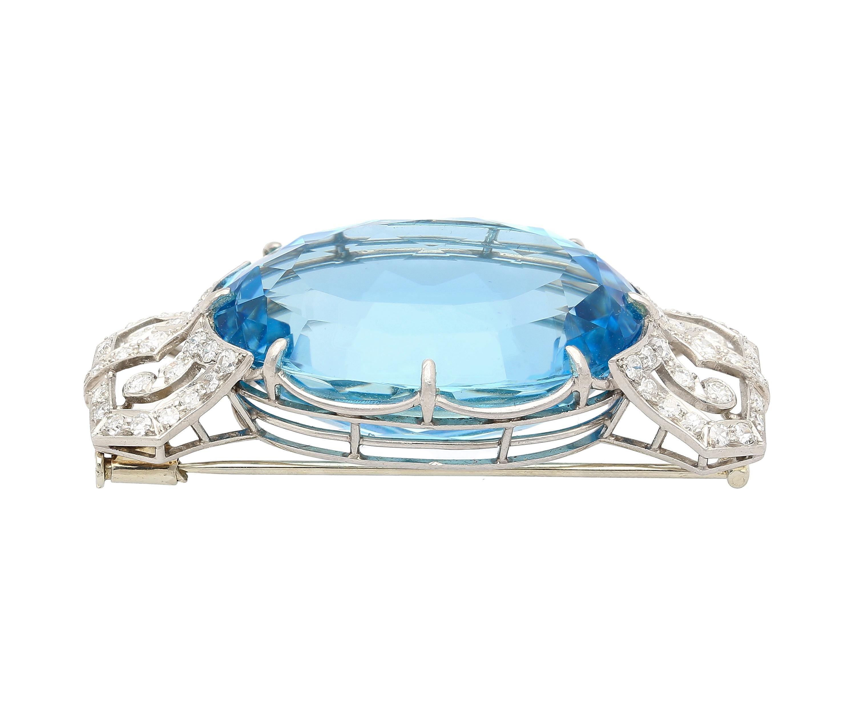 Behold the magnificence of a vintage 62-carat aquamarine brooch, adorned with dazzling diamonds and set meticulously in platinum. This exquisite piece, hailing from the Art Deco to Retro era, embodies timeless elegance and opulence. The captivating