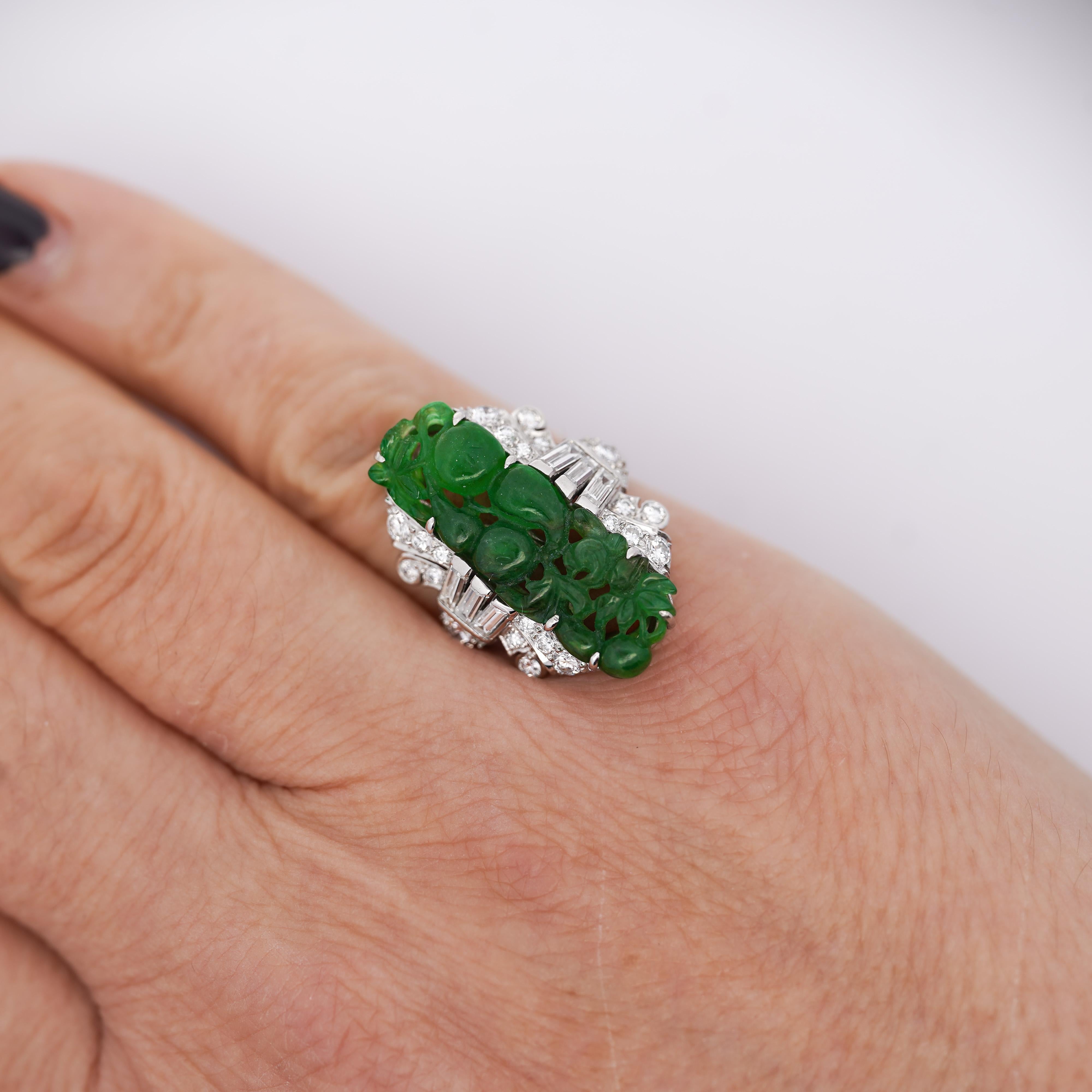 GIA Certified Vintage Carved Jadeite Jade with Baguette and Round Cut Diamond Platinum Statement Ring. Size 5.75, adjustable.

Details:
Item Type: Statement Ring
Metal: Platinum
Size: 5.75 (adjustable)
Weight: 8.59 Grams

Center Stone