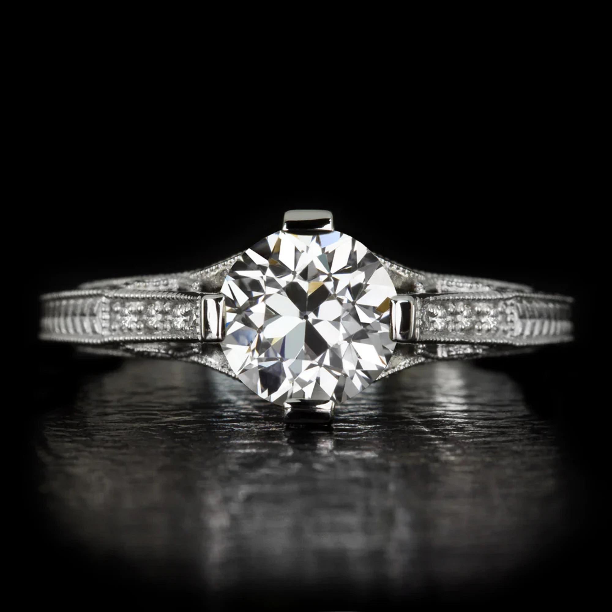 Elegant and full of brilliant sparkle, this vintage style engagement ring’s classic design is crowned by a stunning GIA certified old European cut diamond. The beautifully white and exceptionally clean 0.89ct diamond displays dazzlingly bright