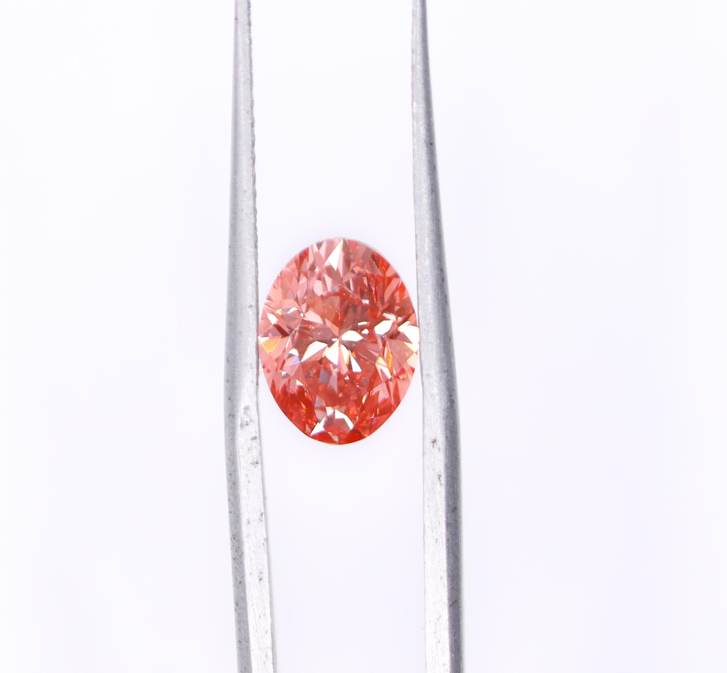 We are so excited to bring you this gorgeous GIA certified 2 carat natural earth mined orangy pink diamond! This piece is HPHT treated giving it an absolutely gorgeous fancy vivid color with an orange flouresence. In a world drowning in overpriced