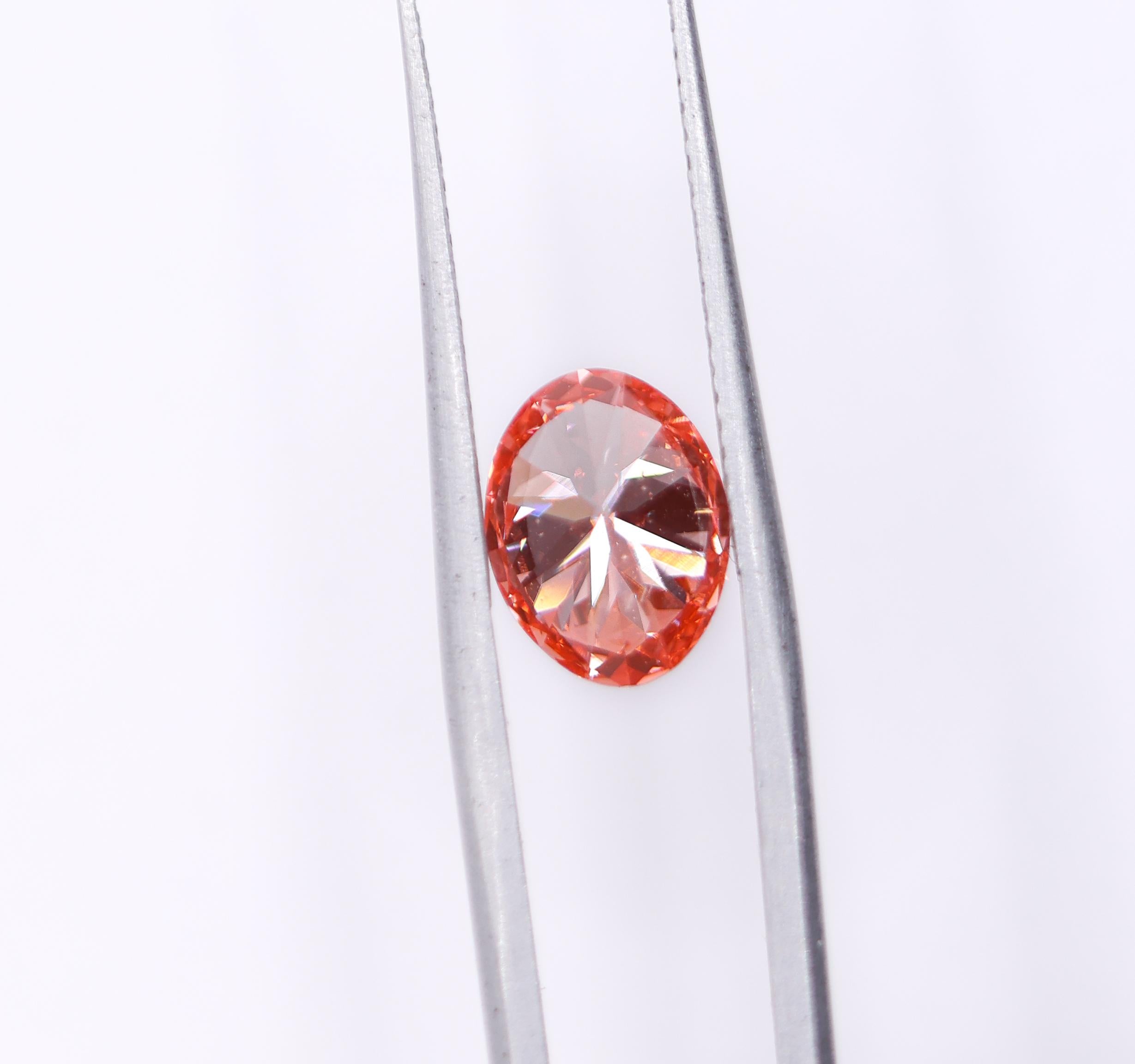 Modernist GIA Certified VS2 2 Carat Orangy Pink Earth Mined Diamond Brilliant Oval 9x7mm For Sale