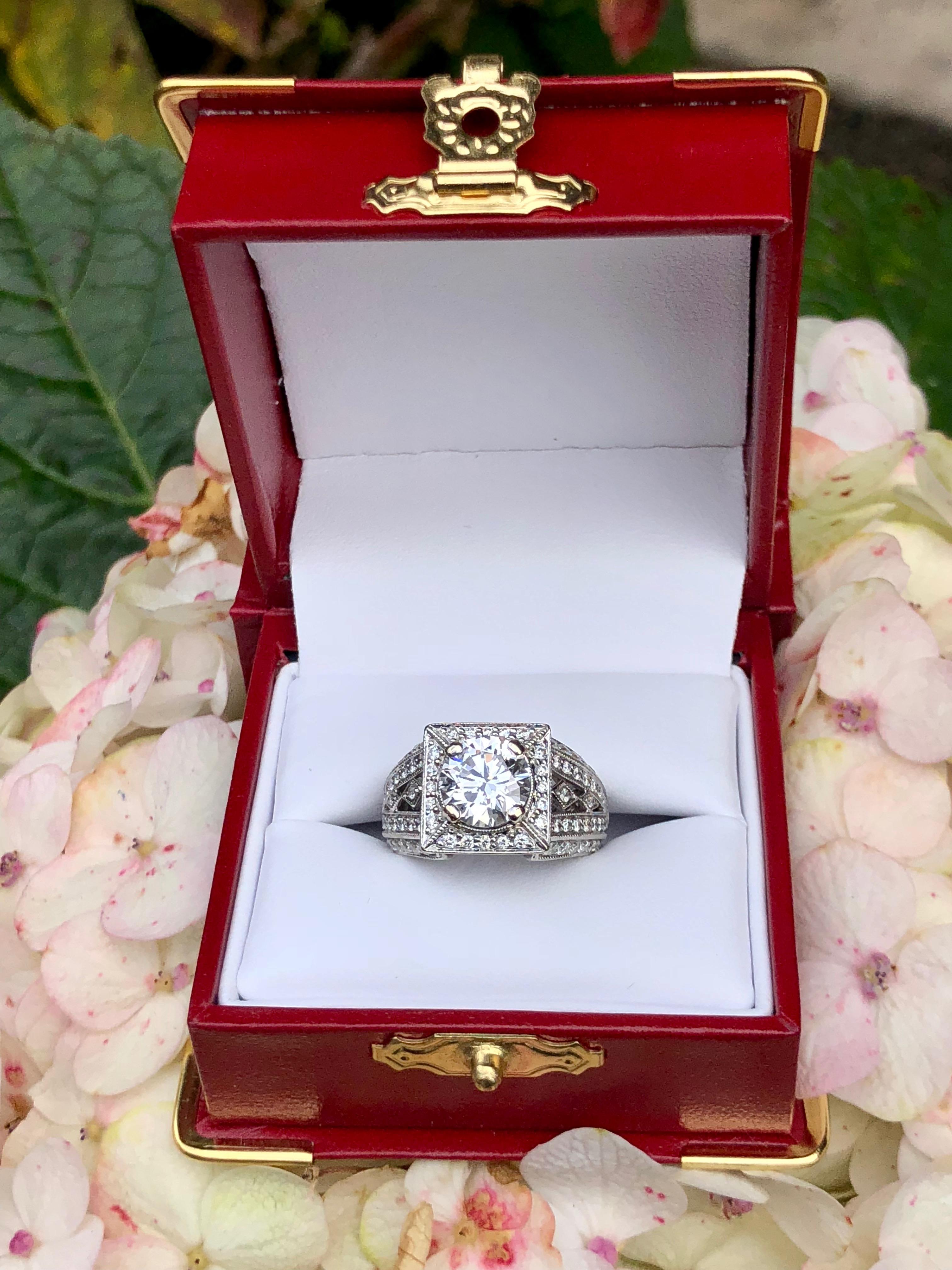 Absolutely stunning, GIA Certified 1.85 Carat VVS2 clarity and F color (colorless) round brilliant diamond set in a custom made, 18 karat white gold, eternity-style engagement, wedding or bridal ring will make someone very happy!

GIA Report #