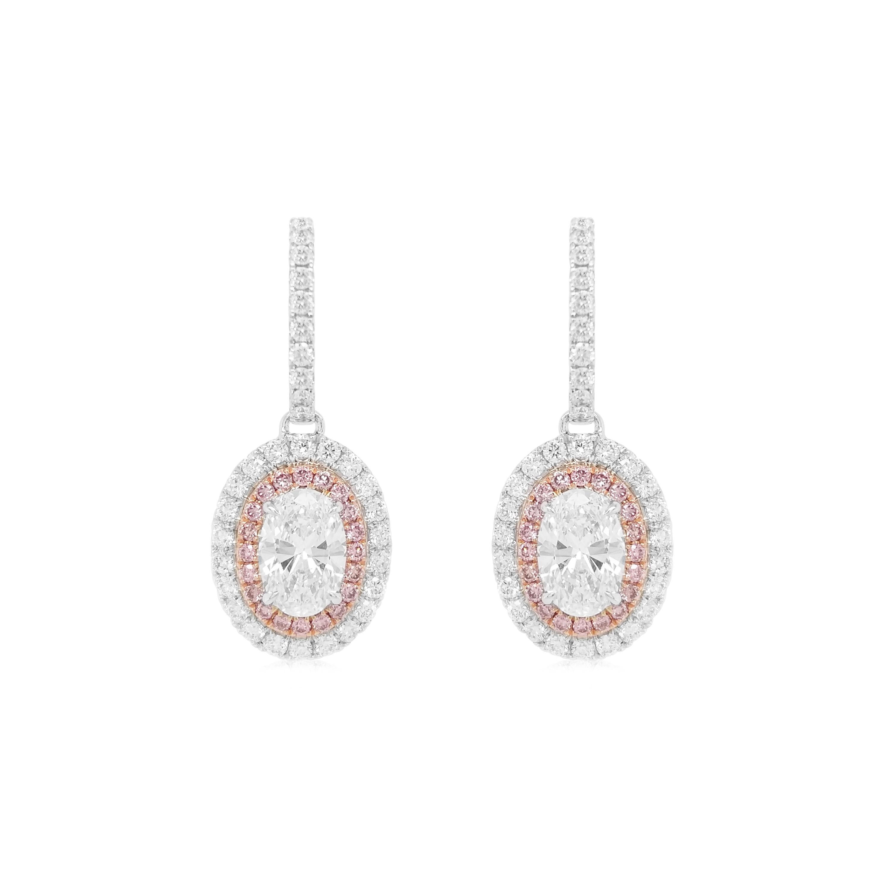 Embrace the Festive Spirit with Timeless Luxury! Beautiful dangling white diamond earrings, with a beautiful oval shape and excellent cut and luster.
The White Diamond is embellished with a halo of rare Pink Diamonds from Argyle mines in Australia,