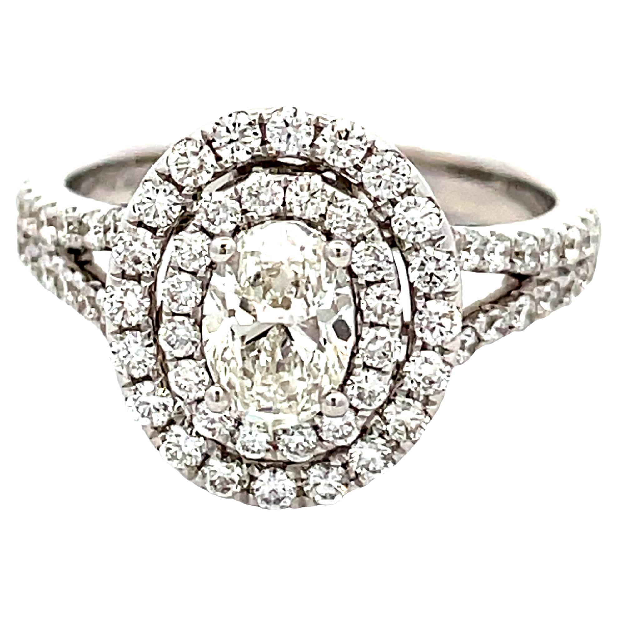 Gia Certified WHITE DIAMOND OVAL 0.70 CT. WHITE DIAMOND ROUND 0.82 18KW Ring